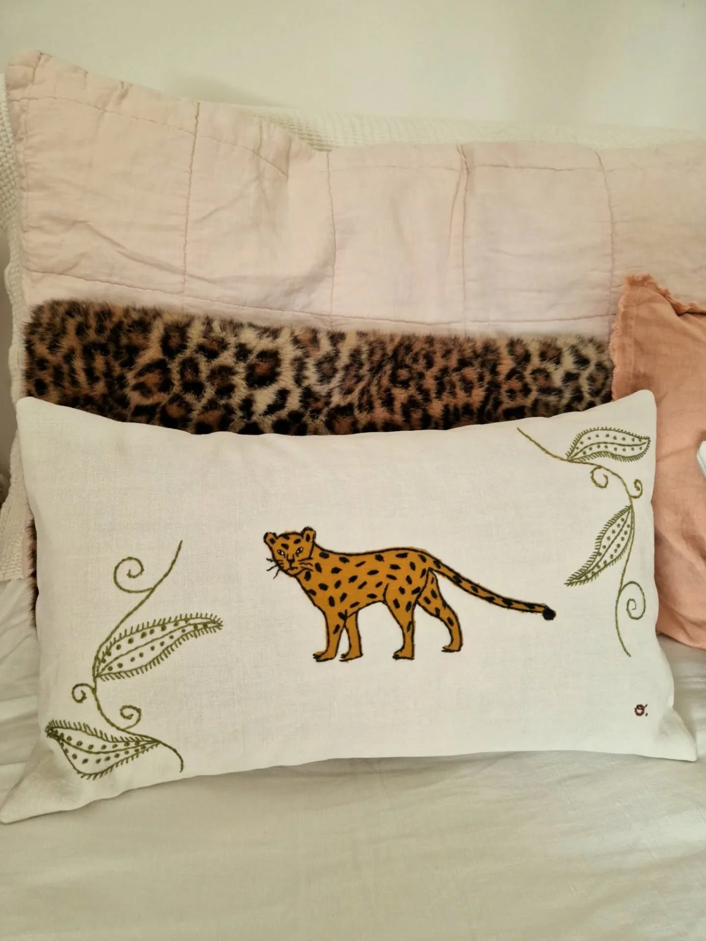 Leopard Cushion in situ...

The design was delicately hand-embroidered on an antique linen that we sourced and upcycled.

The leopard himself is the result of hours of patient work, combining appliqu&eacute; technique with details embroidered by hand