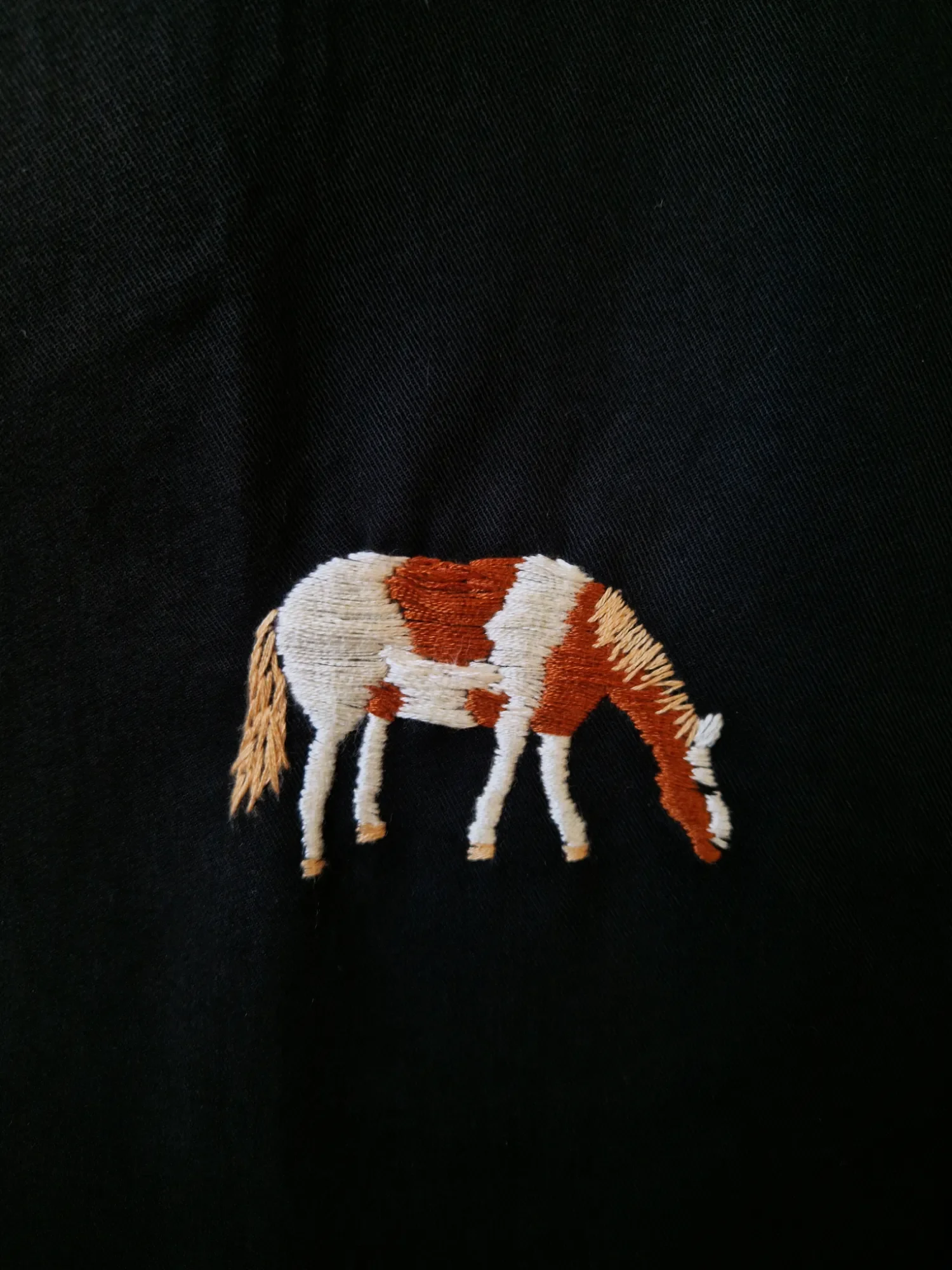 black-shirt-horse-glover-embroidery-detail.webp