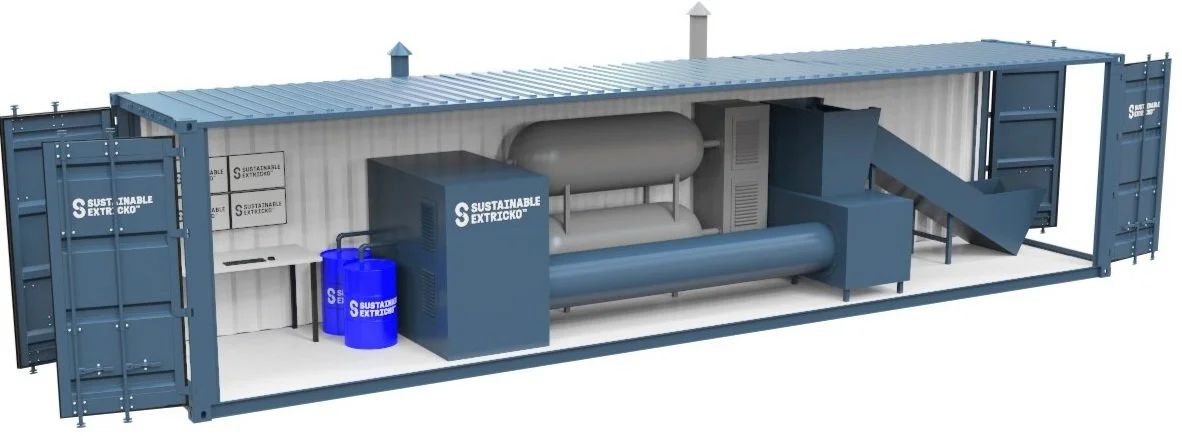 Shipping container modified into an industrial equipment unit with sustainable extraction devices and blue drums inside.