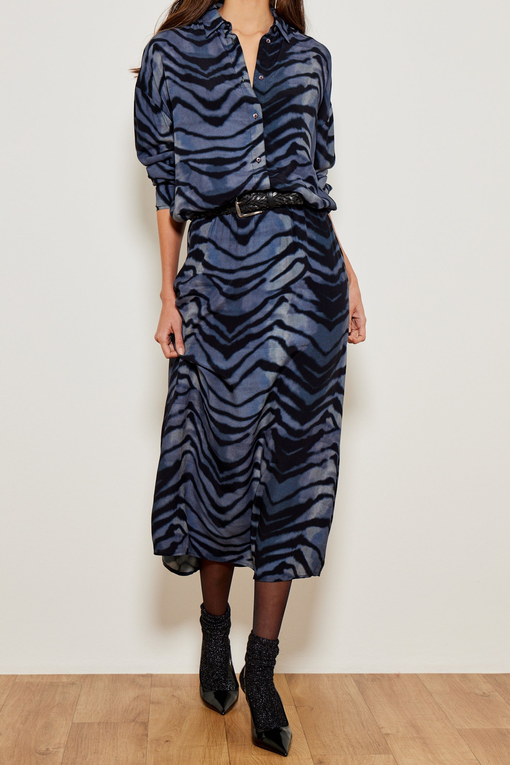 Woman wearing blue ocean animal print skirt by Five Jeans