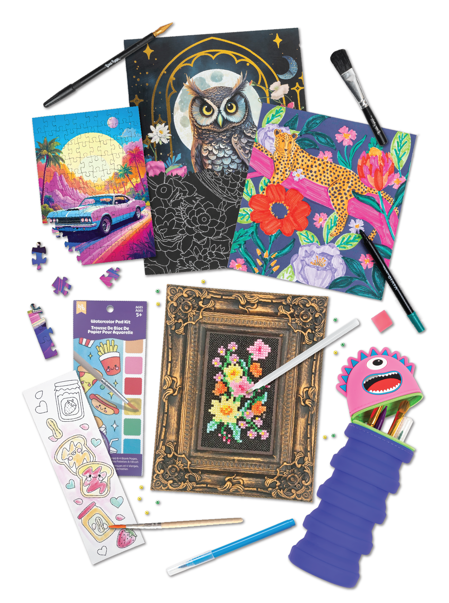 Collection of art and craft supplies including puzzle pieces, printed coloring pages, a framed cross-stitch floral picture, a painted canvas with an owl, a galaxy and leopard print artwork, watercolor paints, and various coloring tools.