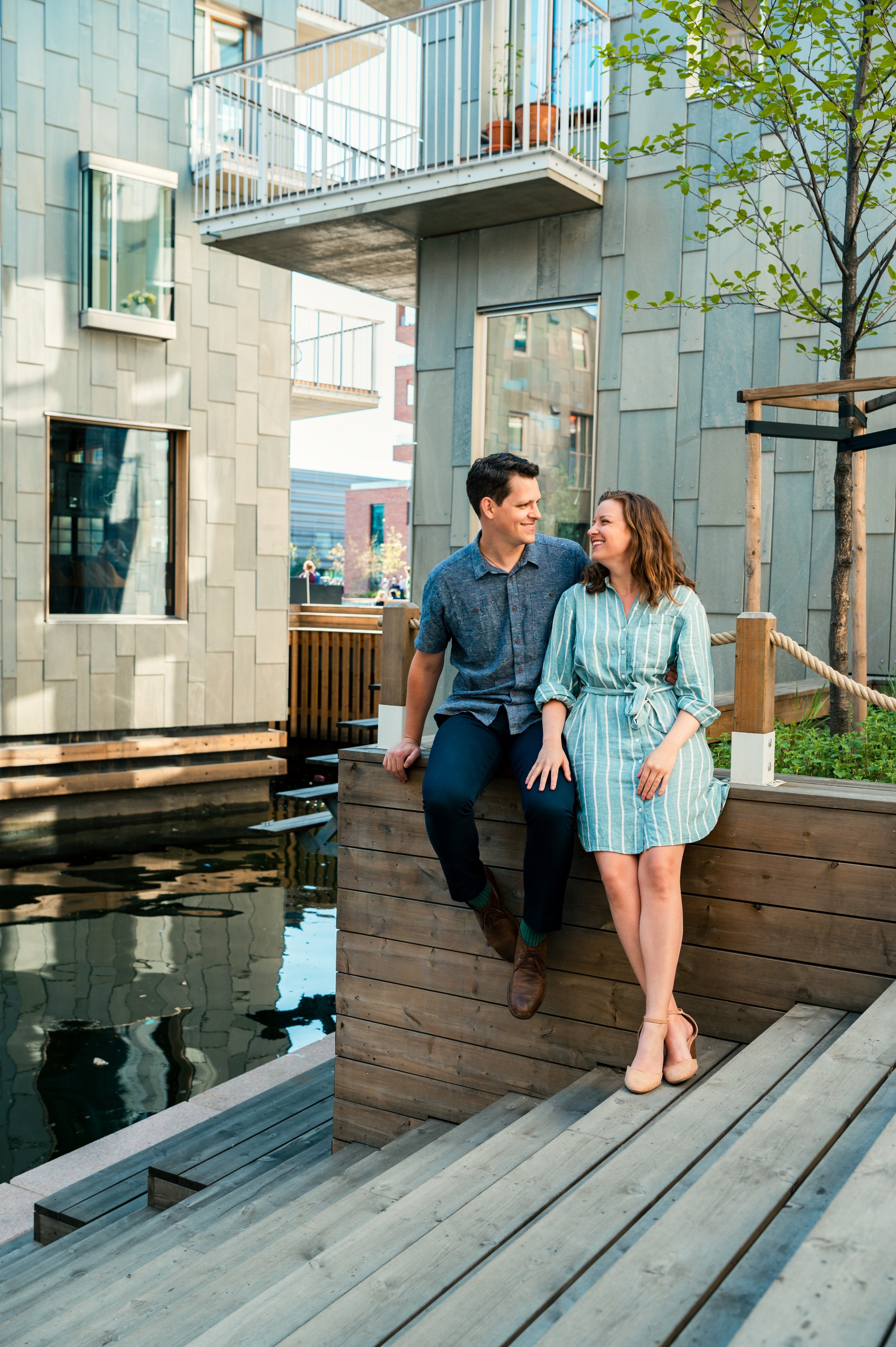 Couple hanging out near the water in Oslo.