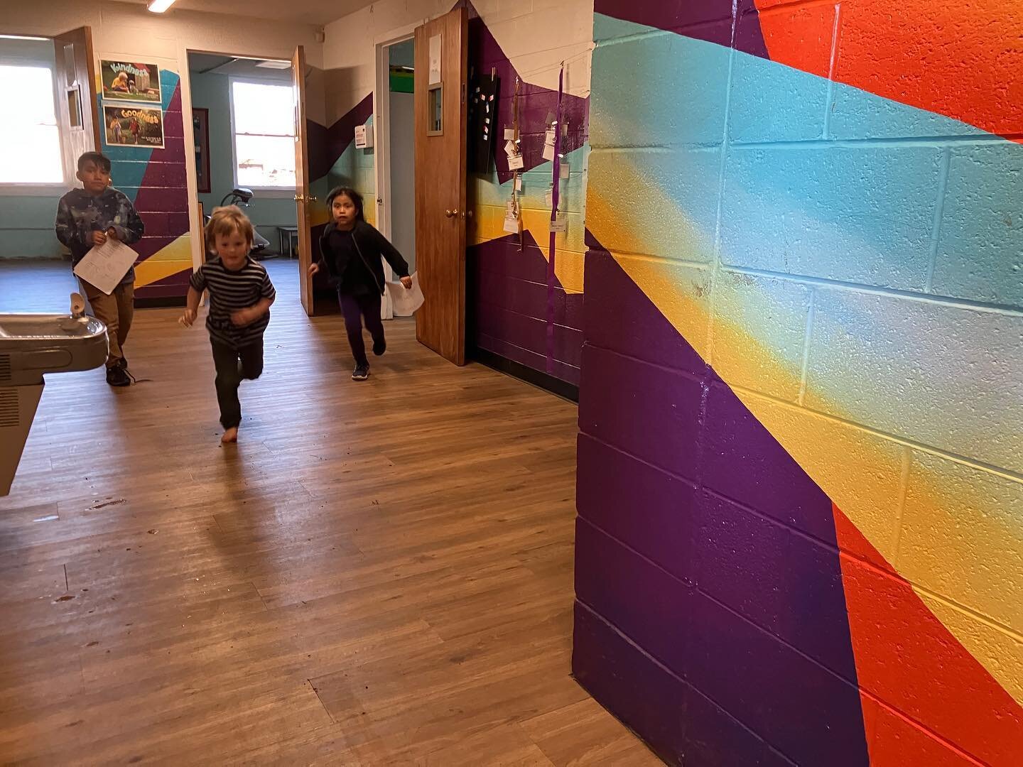 I love muraling spaces for kids. It feels like illustrating the walls, setting the scene for whatever stories the kids are creating. 
💛
I got to go visit this space this week, one I painted years ago now. And to see the hallway full of kids (my kids