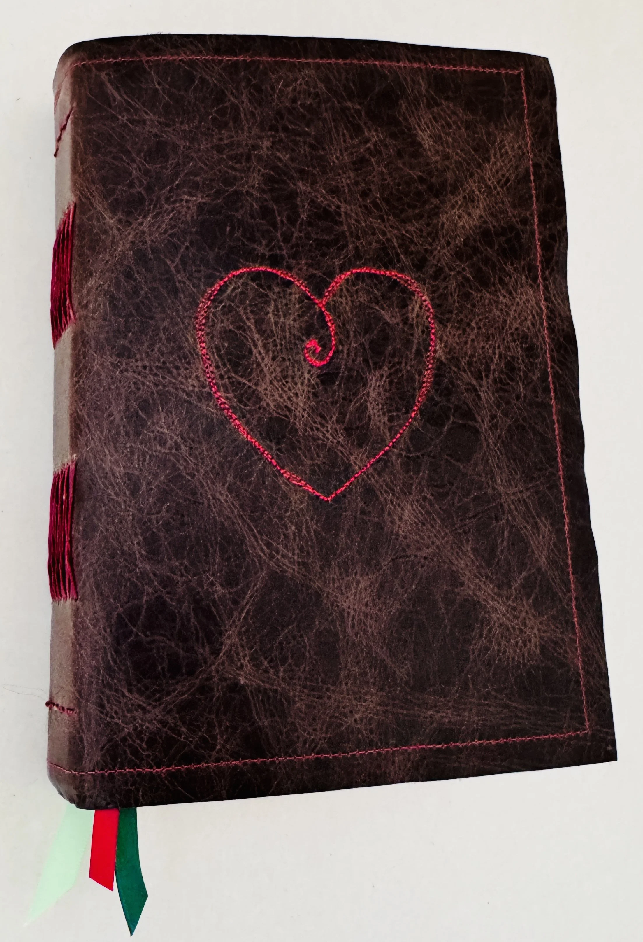 1_Outside Cover Showing Leather Ribbons Heart and some binding.JPG