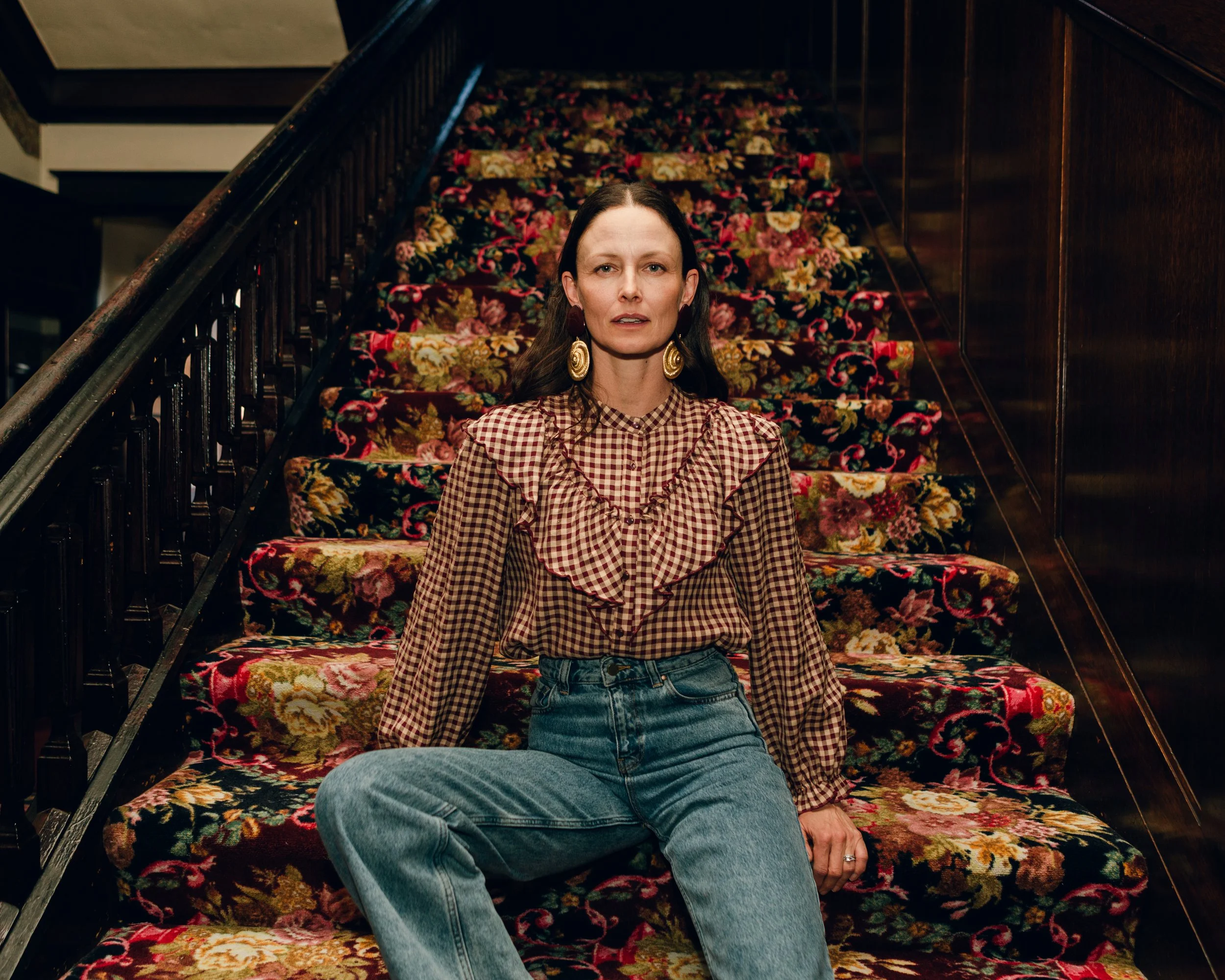 Editorial portrait on the historic staircase inside the historic Buffalo Bill Irma Hotel in Cody, Wyoming.