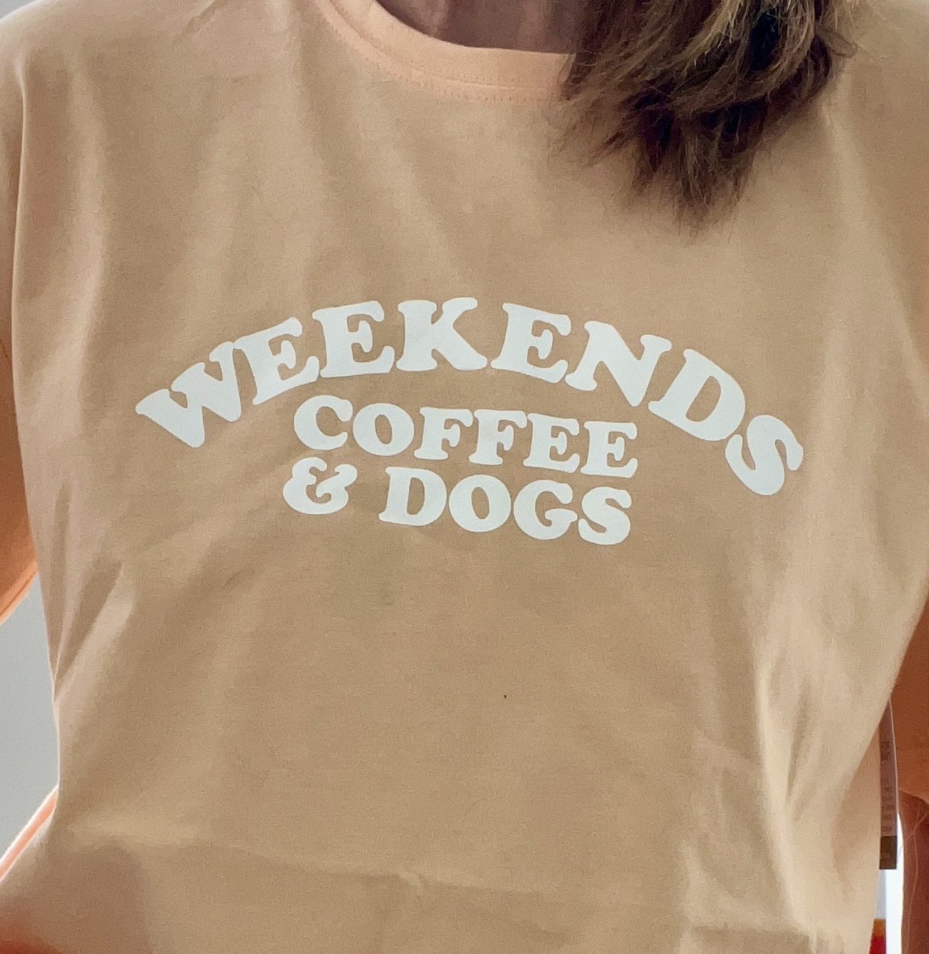 Weekends Coffee and Dogs Peach Tee.jpg