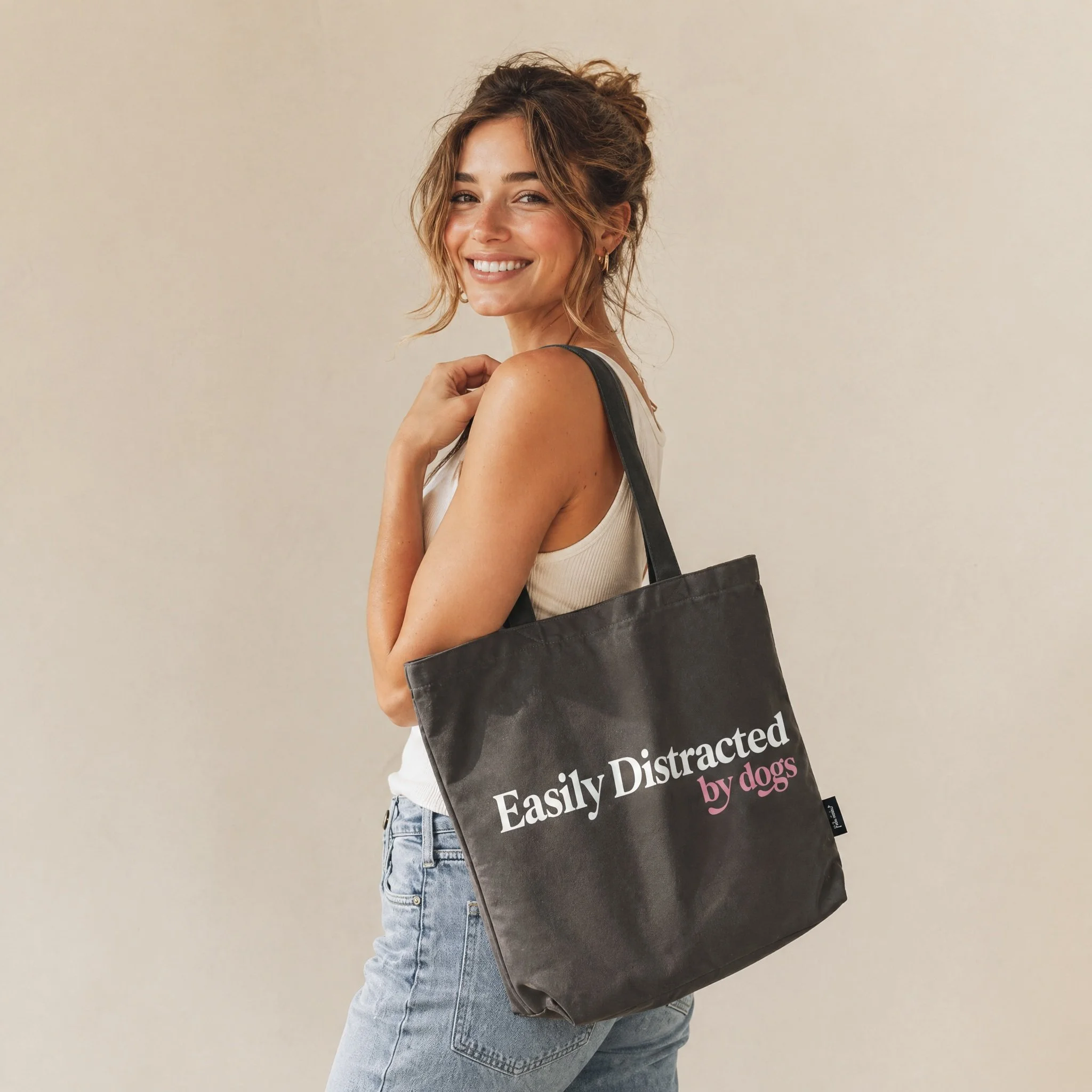 Easily Distracted by Dogs Tote in Charcoal on Model.jpg