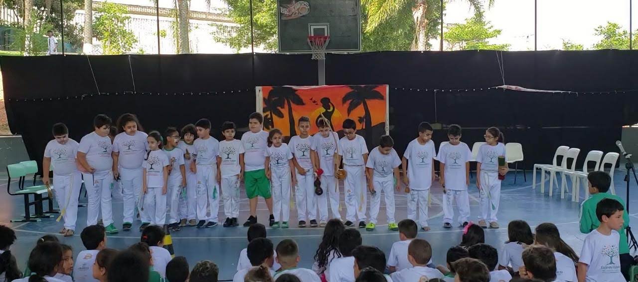 Students from 3rd and 4th grade during the final year's presentation. They presented a performance that mixed capoeira, dance, and theater. The capoeira teacher and I ran the show (2019)