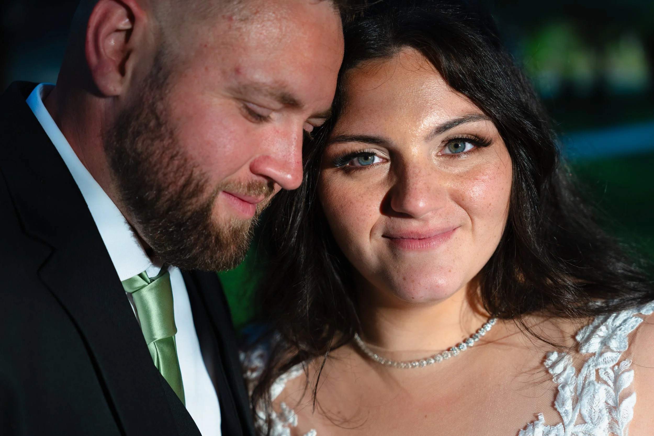 Close up of bride looking at camera during couples photos at The Carriage House in Galloway, New Jersey.