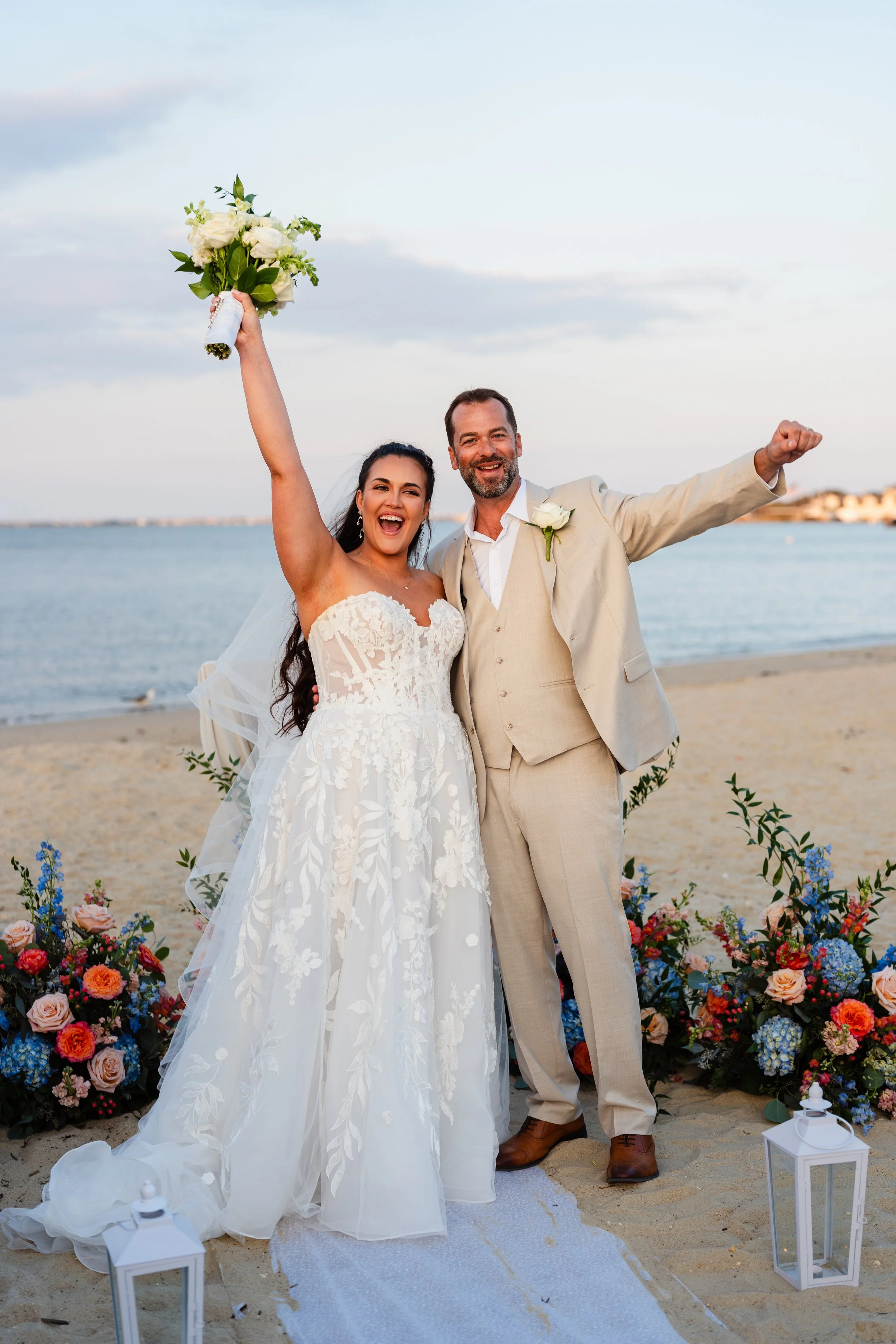 Bride and Groom cheering after saying I Do on Ocean Gate Beach in Ocean Gate, New Jersey. 