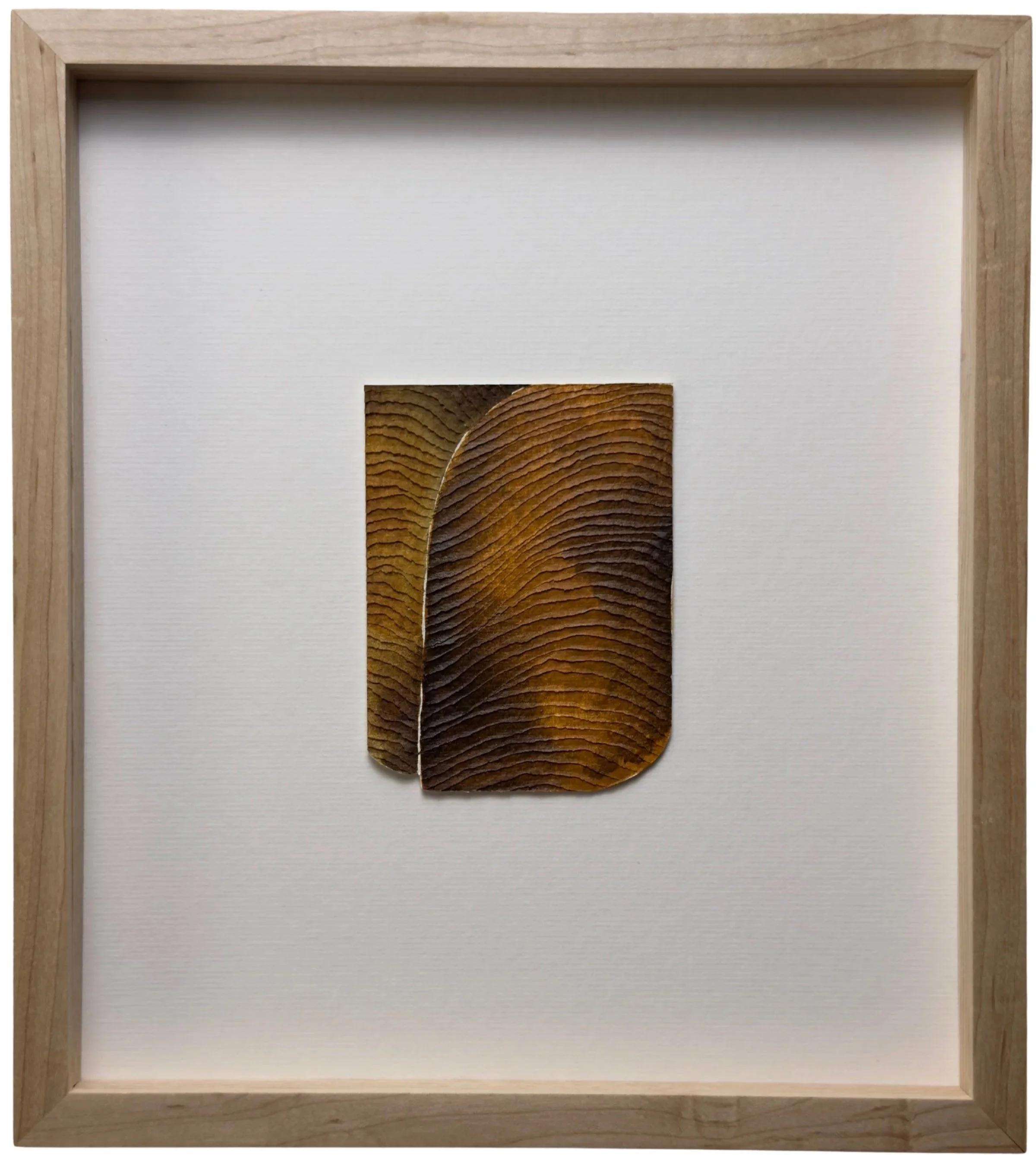 textured brown painting on paper with carvings, framed in ash