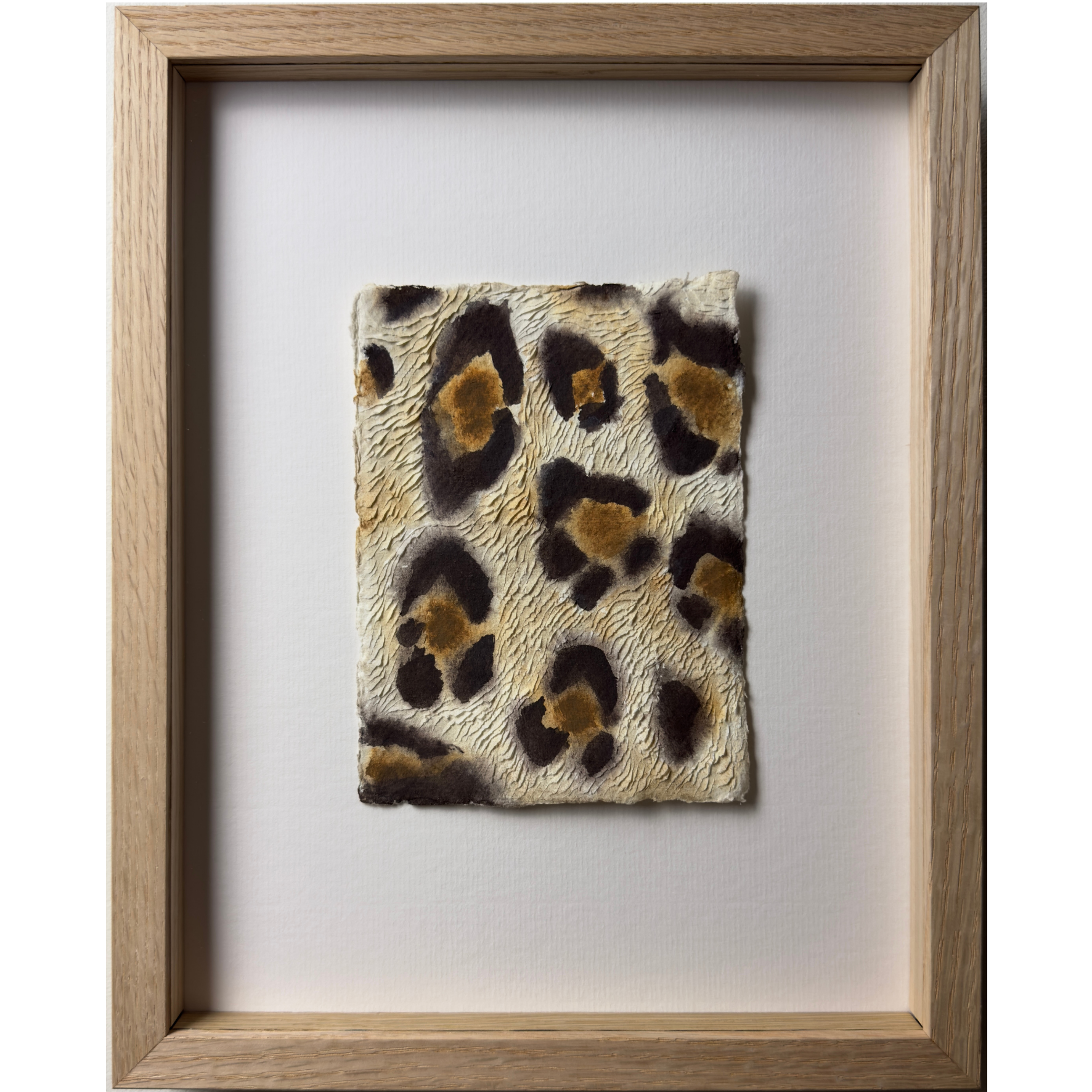 Leopard print original watercolour painting on paper with textured carvings representing the fur. In oak wood frame and ArtGlass
