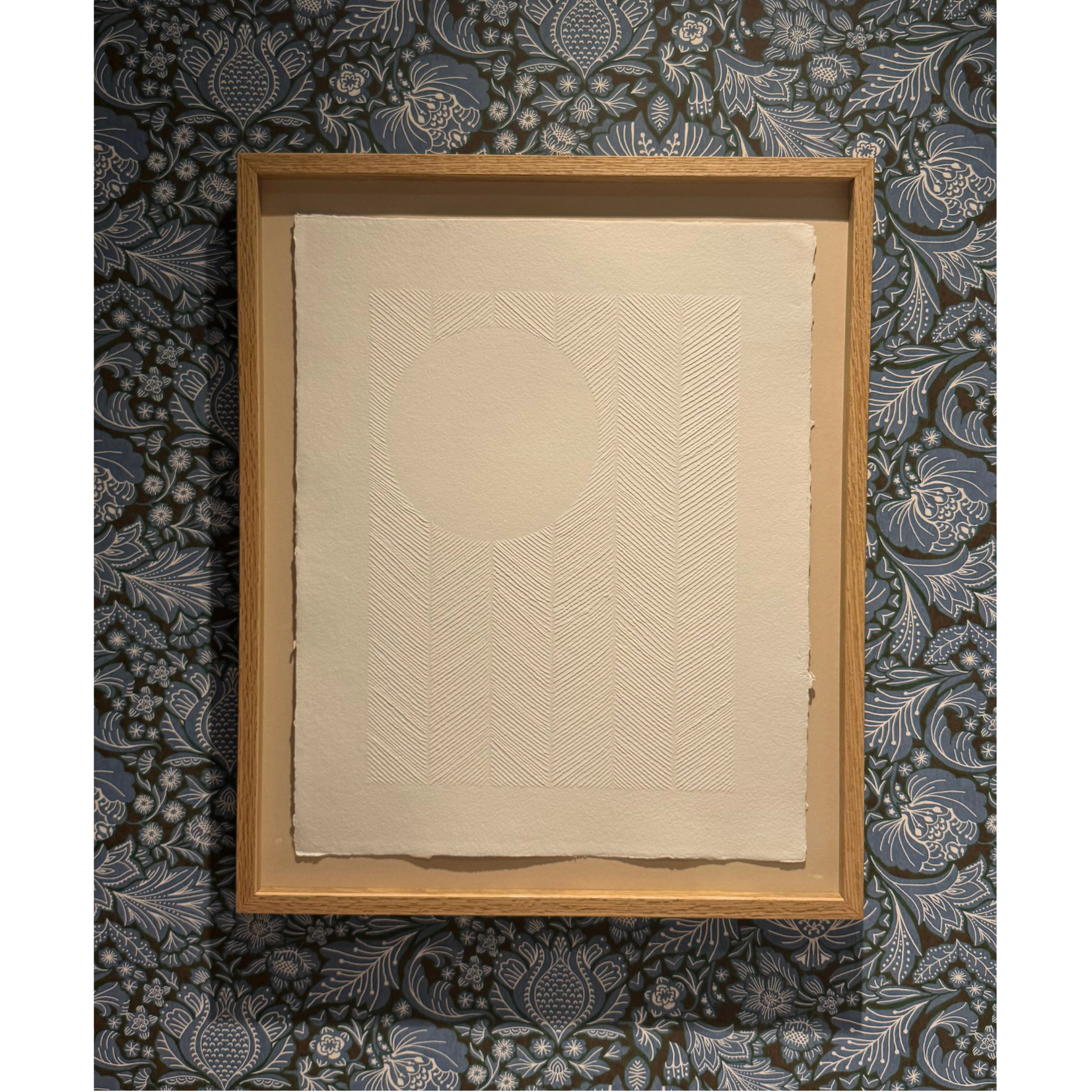 Original textured white artwork. Paper carving of the moon in the sky with carved chevron pattern, framed in bespoke made oak frame with ArtGlass. 58 x 48cm.