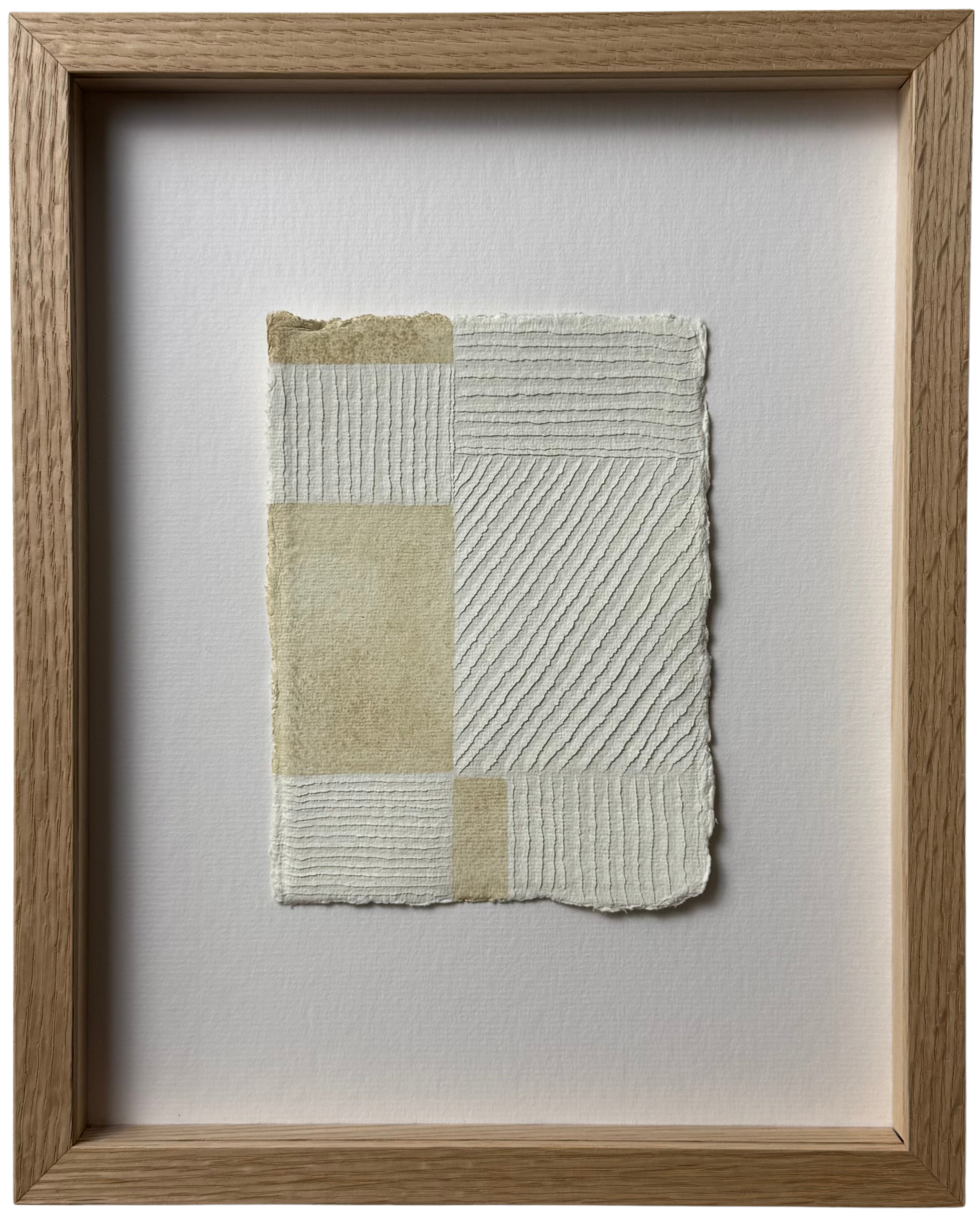 white and buff colour textural artwork on paper with carvings in a geometric block formation inspired by the work of Piet Mondrian. Framed in Oak with ArtGlass
