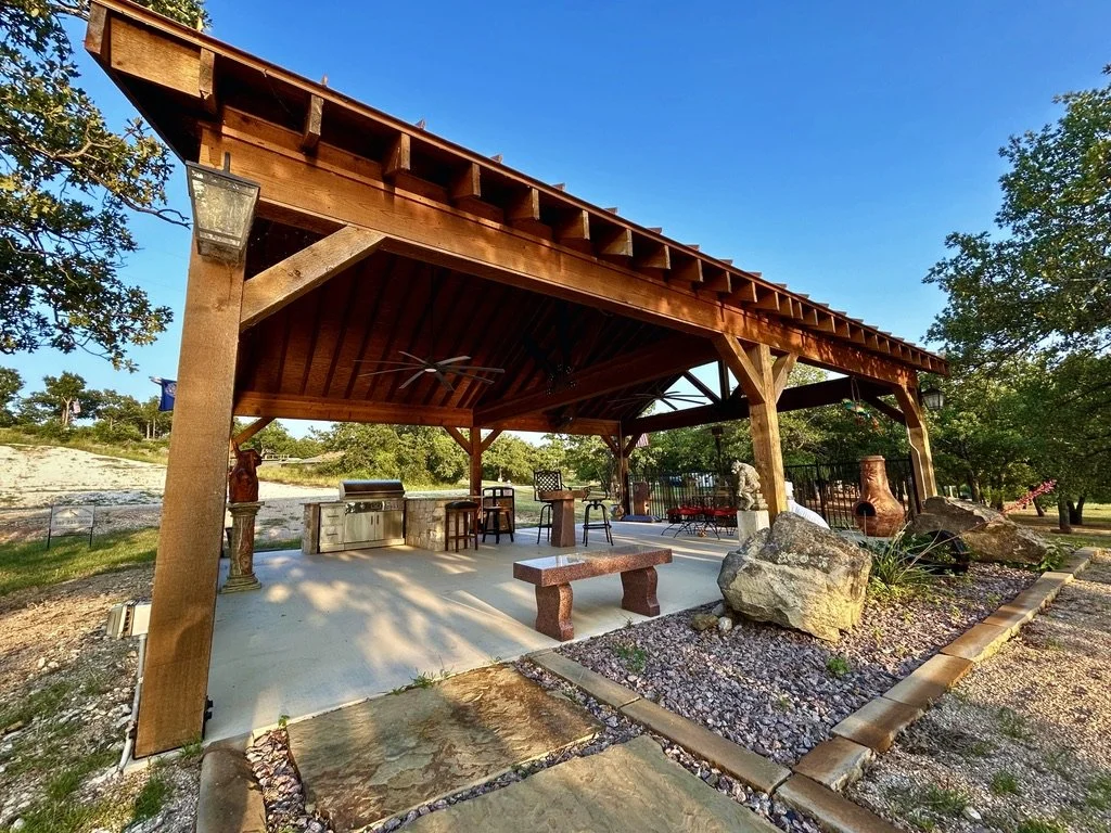 Image of home with trees in the center of 203 Fairway drive in Nocona Hills