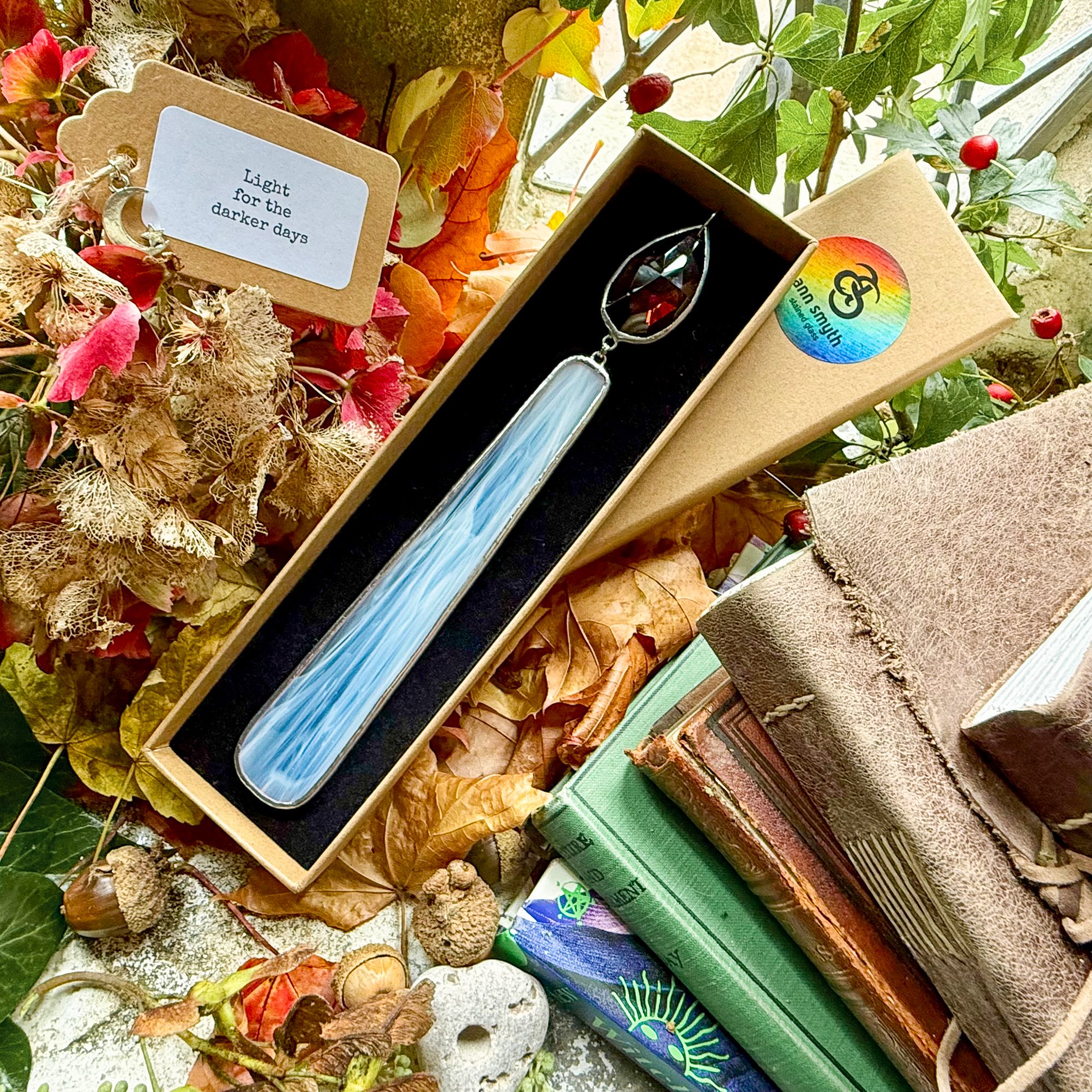 Stained glass candle with amber crystal flame presented in luxury Kraft gift box