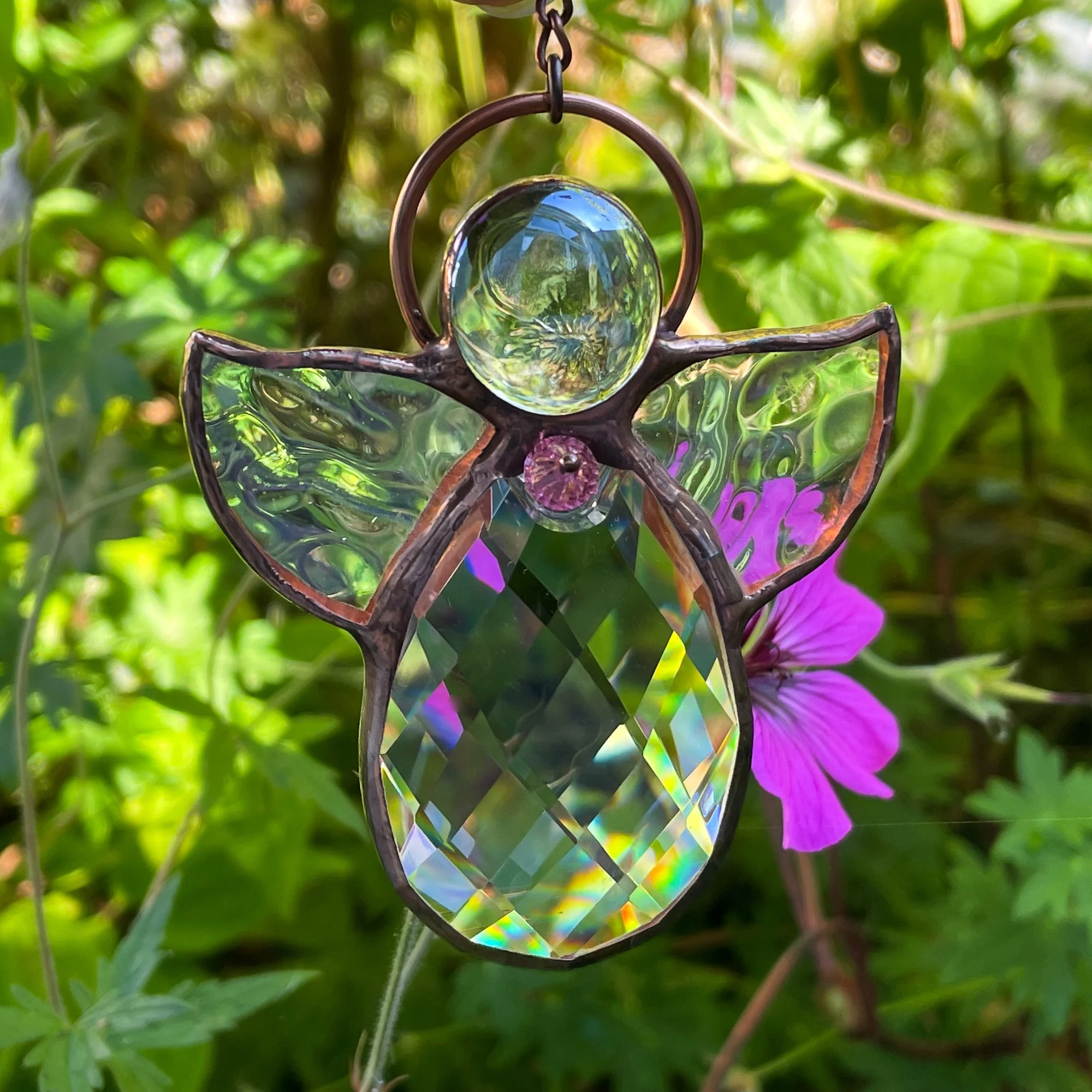 A stained glass crystal angel sun catcher.