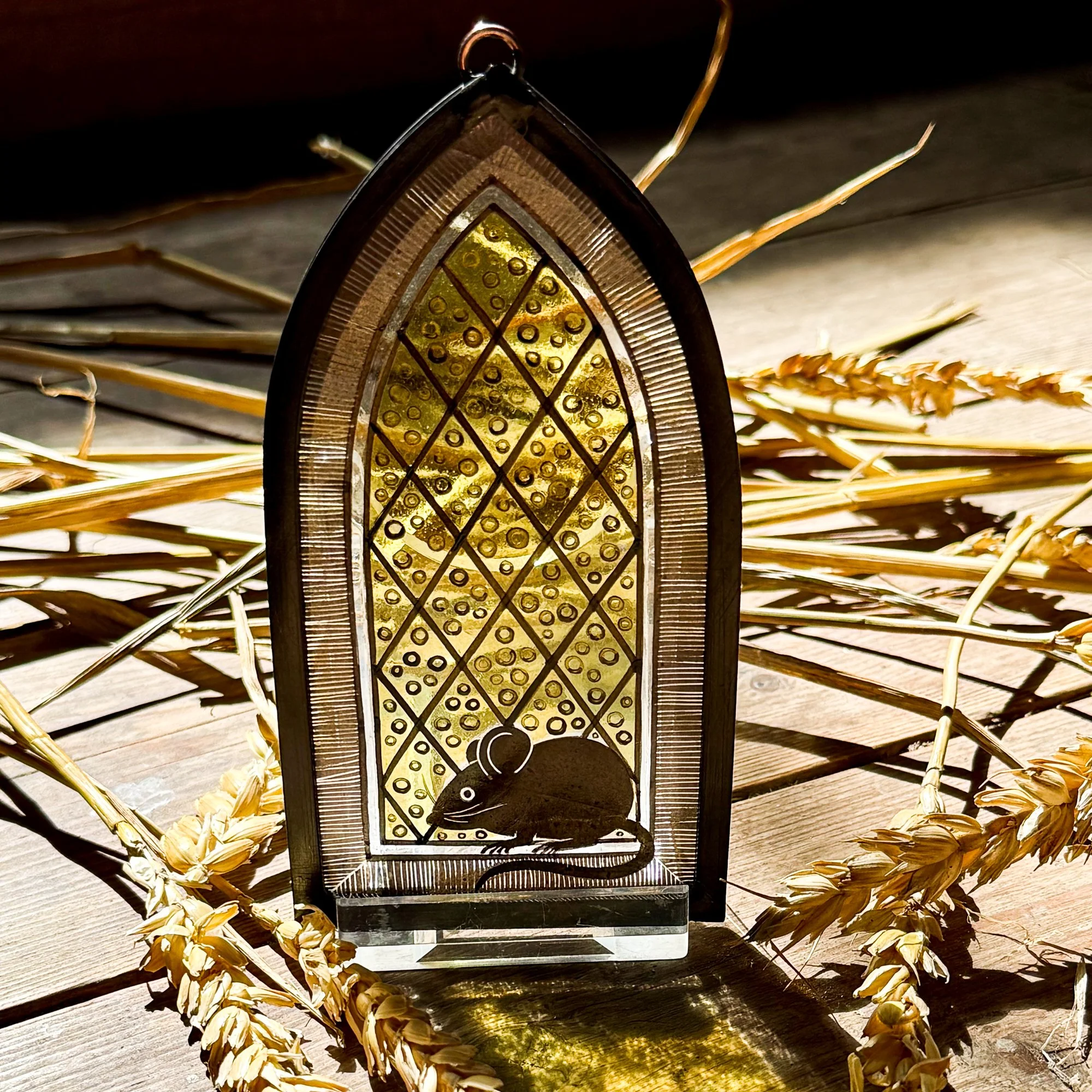 Stained glass church mouse photographed in an old corn mill