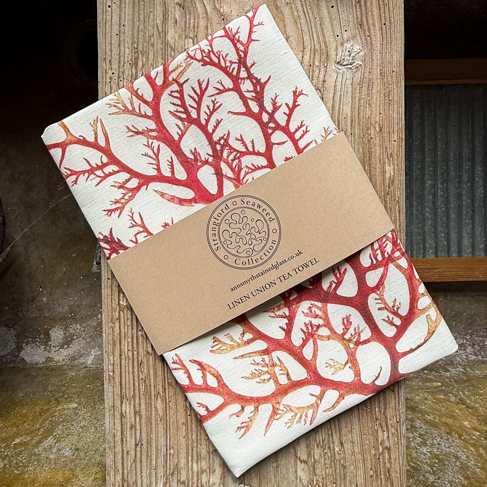Cock's comb seaweed tea towel presented with bespoke branded wrap