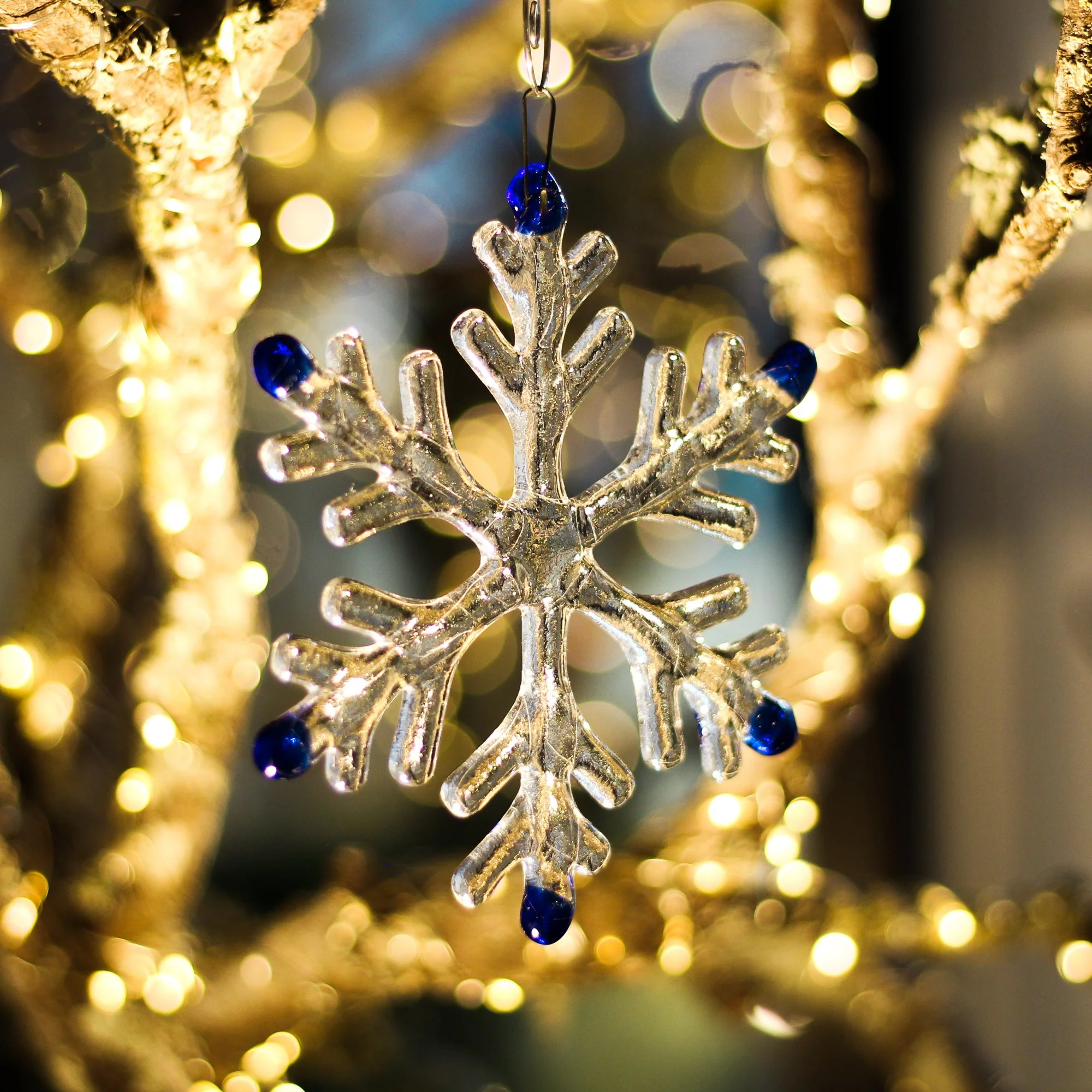 Glass snowflake Christmas ornament hand crafted by Ann Smyth Stained Glass