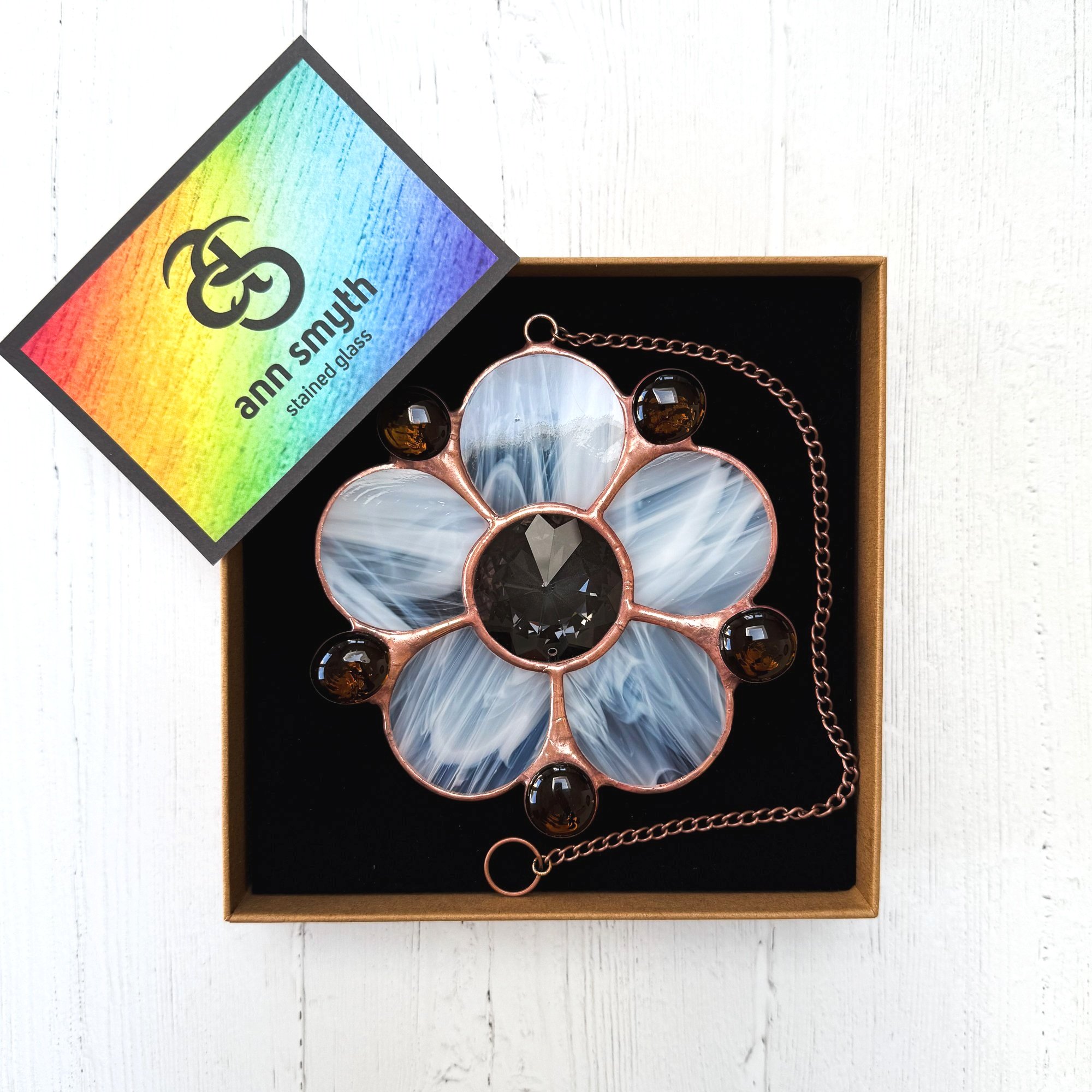 Eco friendly packaging detail with Ann Smyth Stained Glass branding.