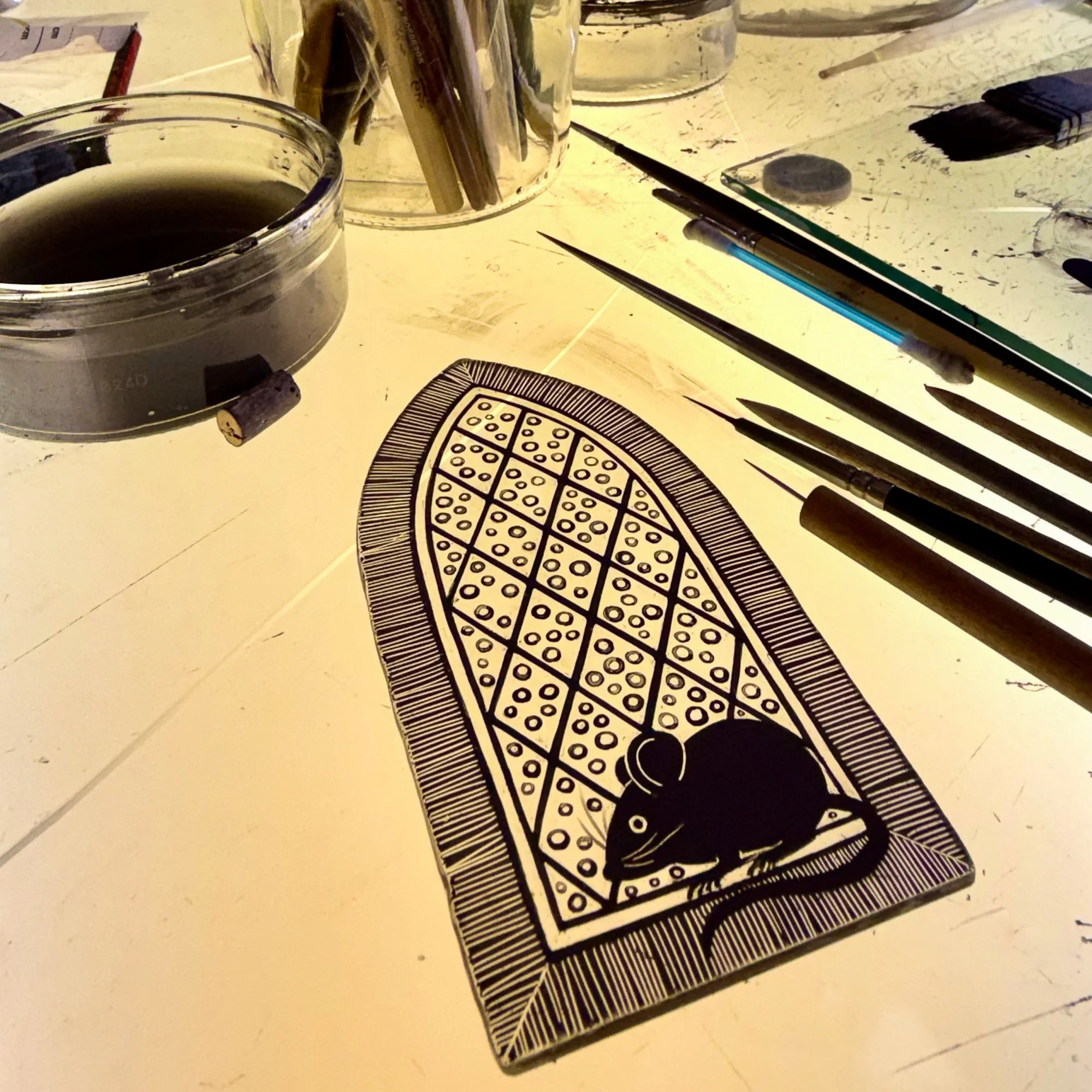 Glass painting in progress on the light table