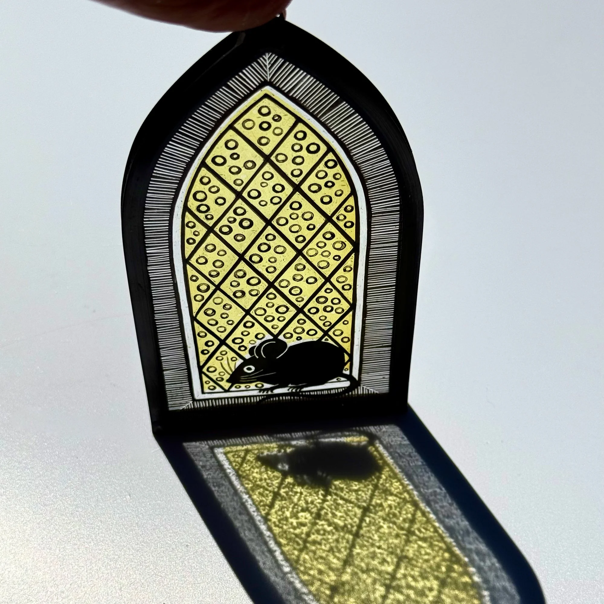 Stained glass mouse showing beautigul light refraction as the sun hits the panel