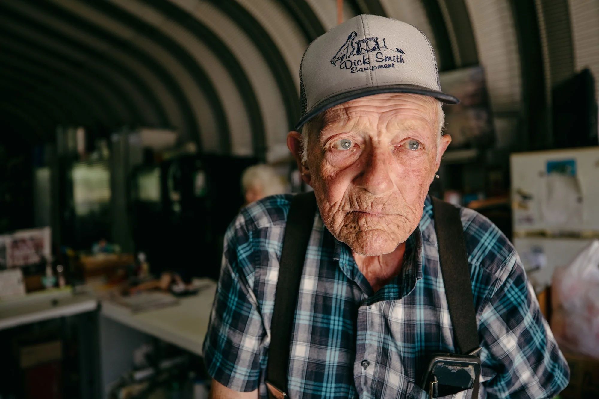 Charles Strickland, 87, poses for a portrait on his farm, Strickland Farm, on Wednesday, July 12, 2023. Strickland has been selling produce off of highway 401 in Youngsville, N.C. for decades. But recently, construction to widen the road is threateni