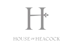 Logo with a large gray 'H' and the words 'HOUSE or HEACOCK' underneath on a black background.