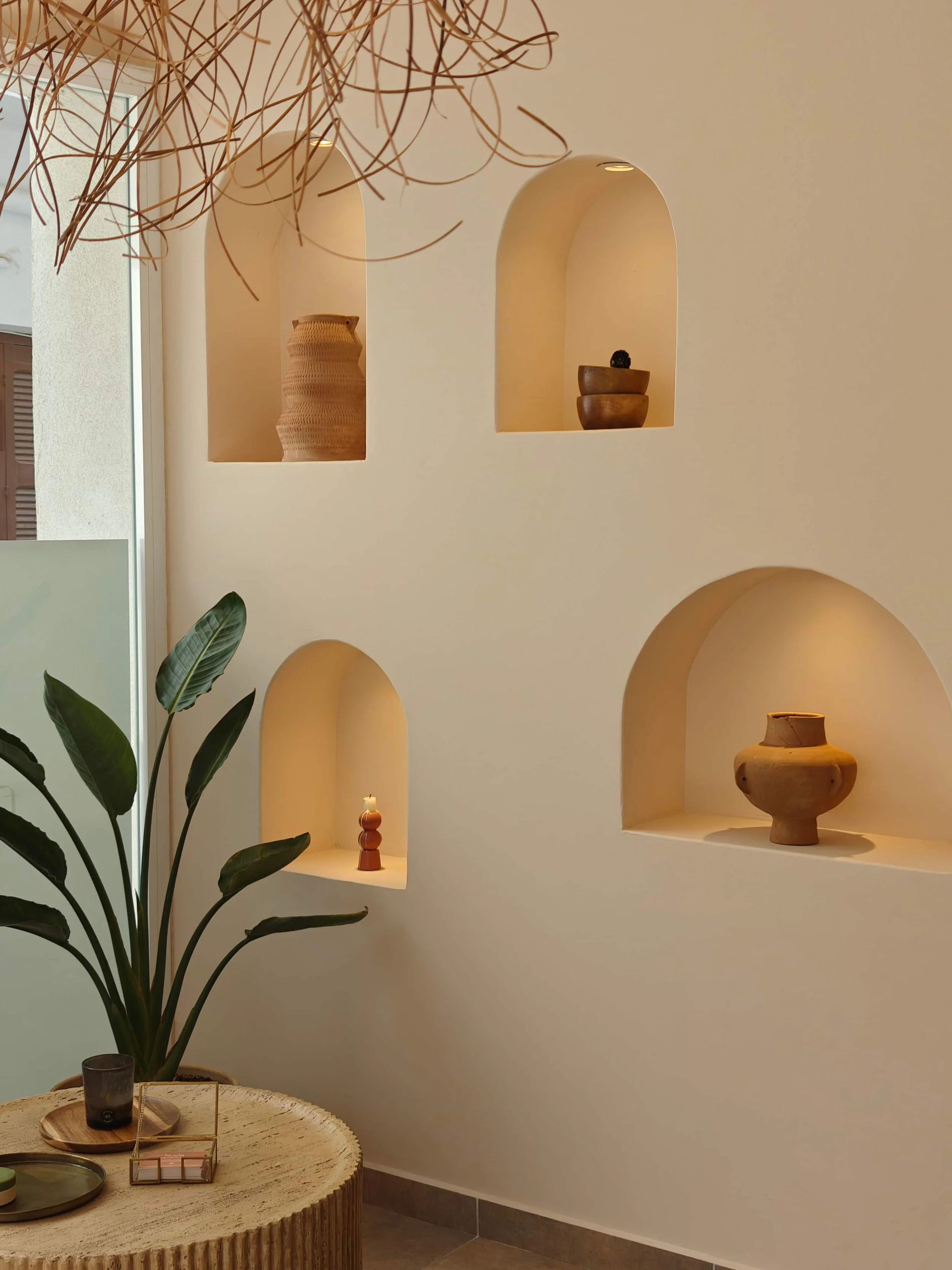 A serene private treatment room at Naós Somatic Sanctuary in Kardamena, Kos, designed for nervous system regulation and deep stillness