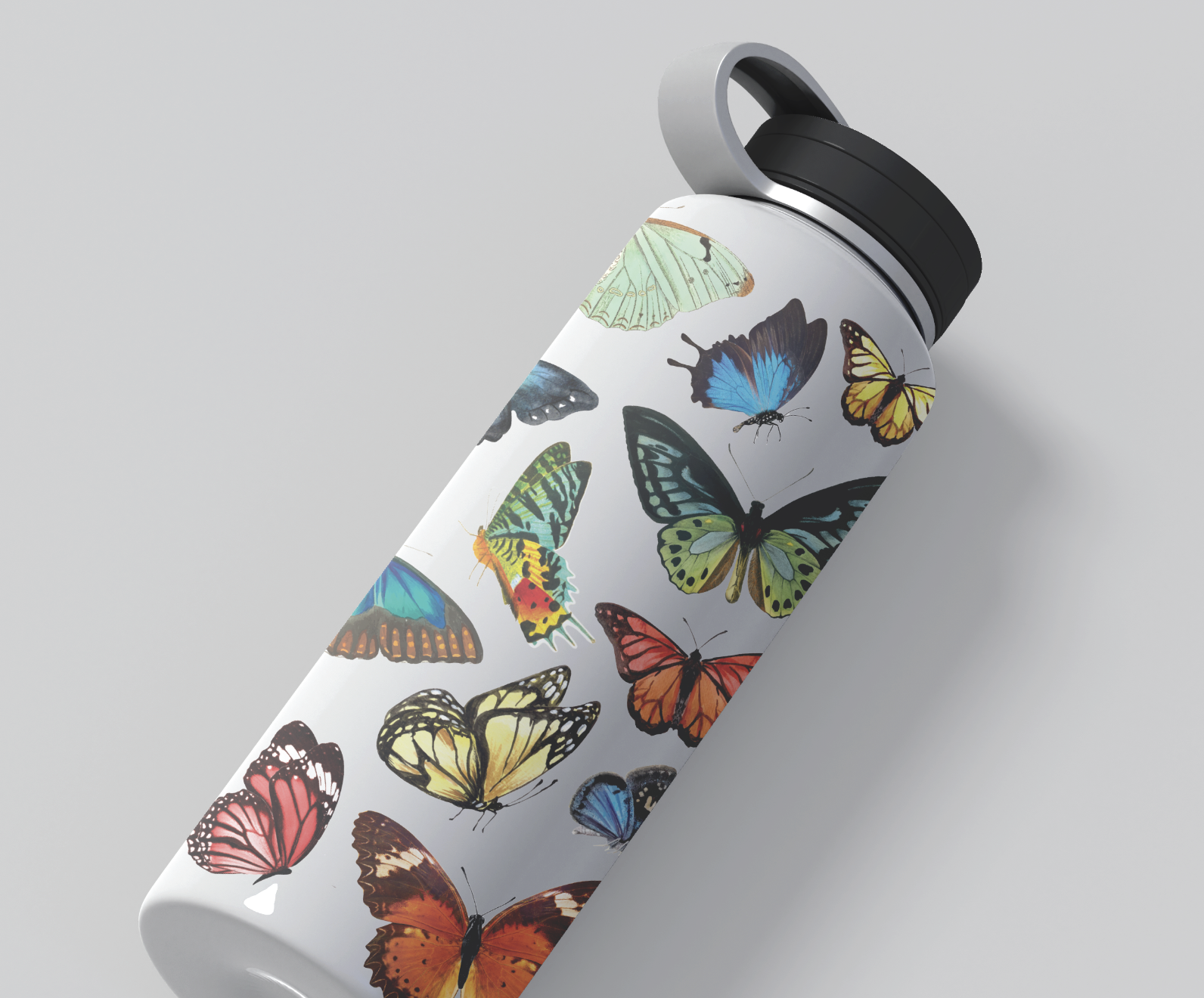 White water bottle with a black lid, decorated with colorful illustrations of various butterflies.