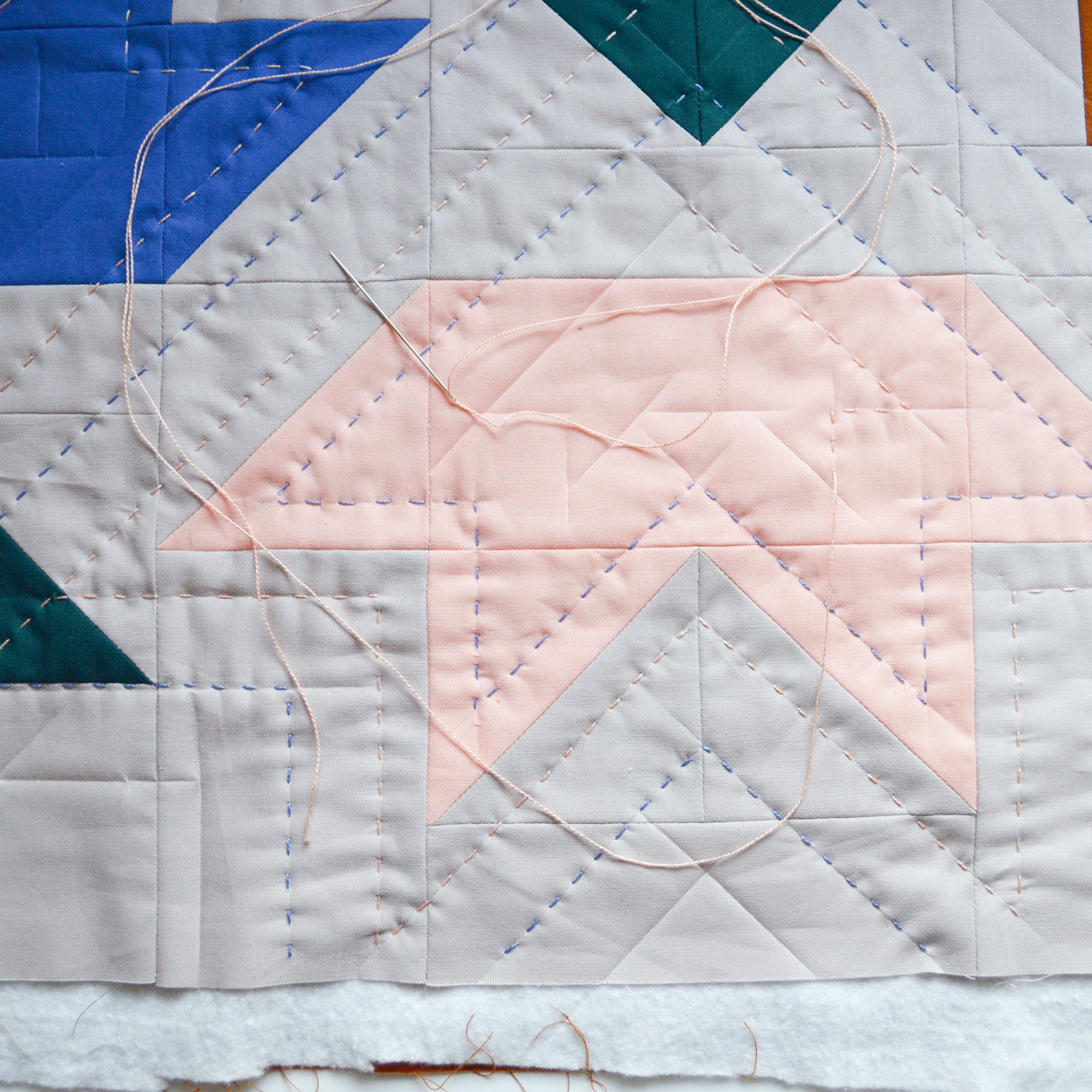  a partially hand-quilted mini quilt with a star design 