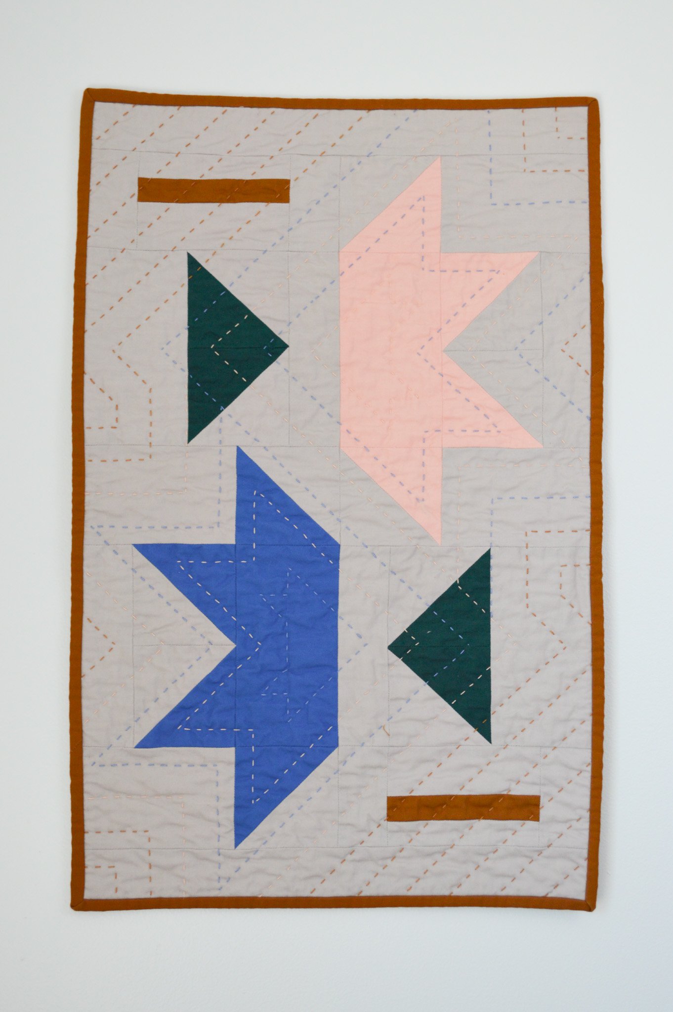  a modern mini quilt with is star pattern 