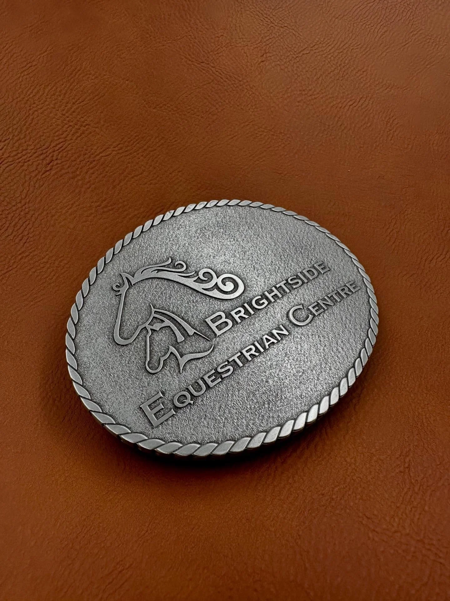 @brightsideequestrian decided to switch things up for their awards and go with custom belt buckles!