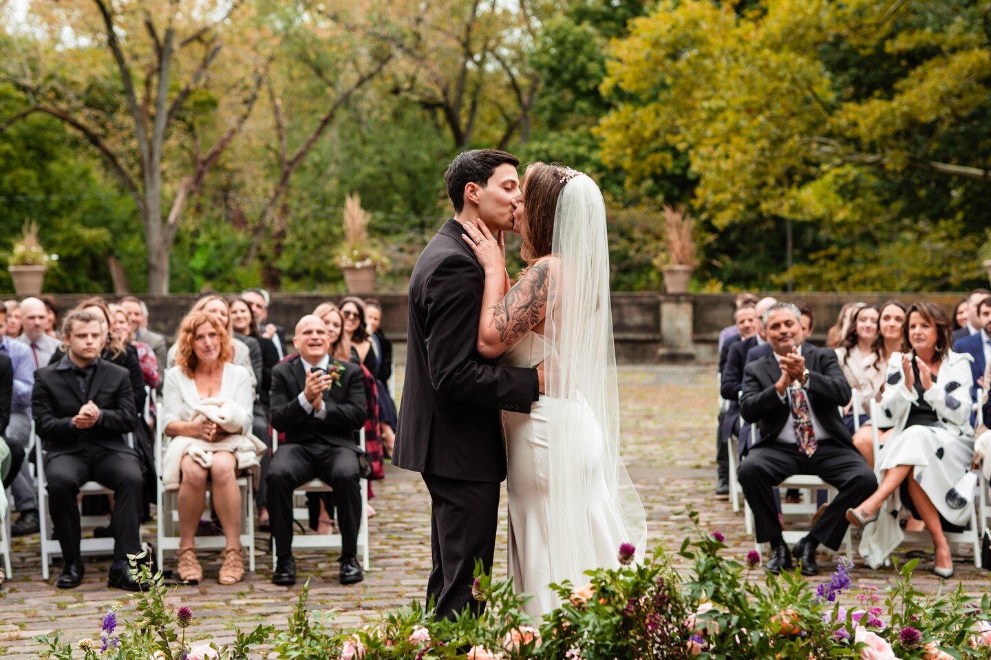 We love a unique first kiss perspective. This intimate ceremony in the heart of Cleveland&rsquo;s Cultural Gardens was truly magical and gave us the perfect opportunity to capture all the love surrounding these two cuties.