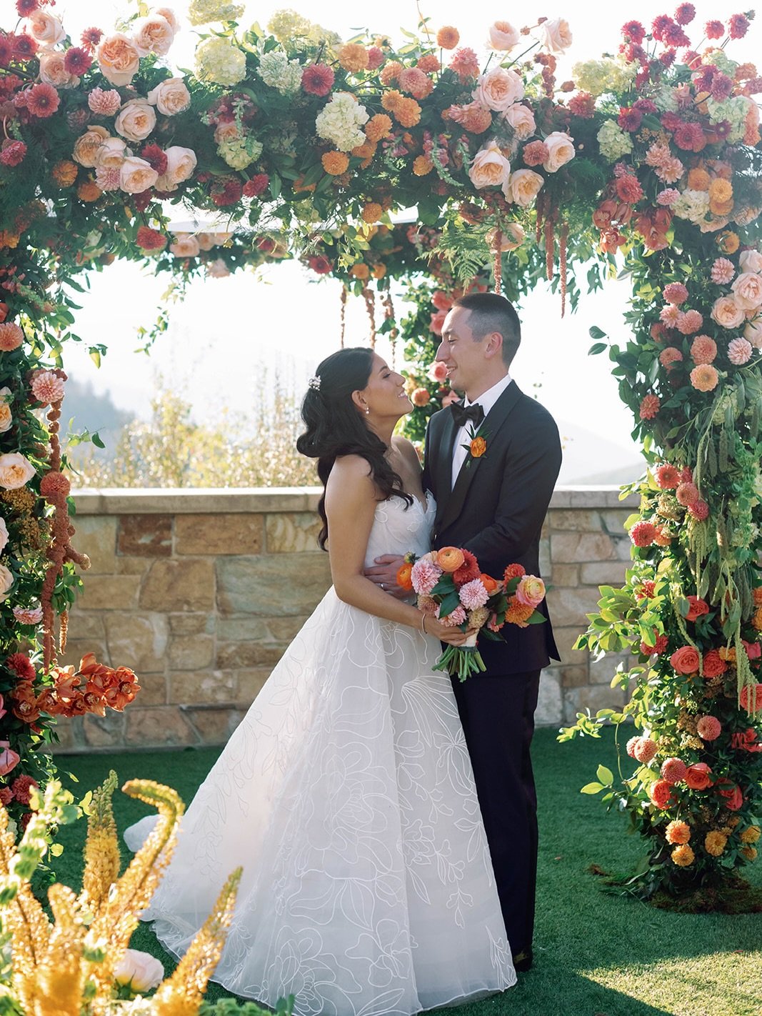 Florals as vibrant as your love story 🧡
S &amp; J&rsquo;s magical chuppah was overflowing with blooms, embracing color at every turn and showcasing the most unique flower varieties in the dreamiest palette.
An organic, bloom-blocked aisle led the wa