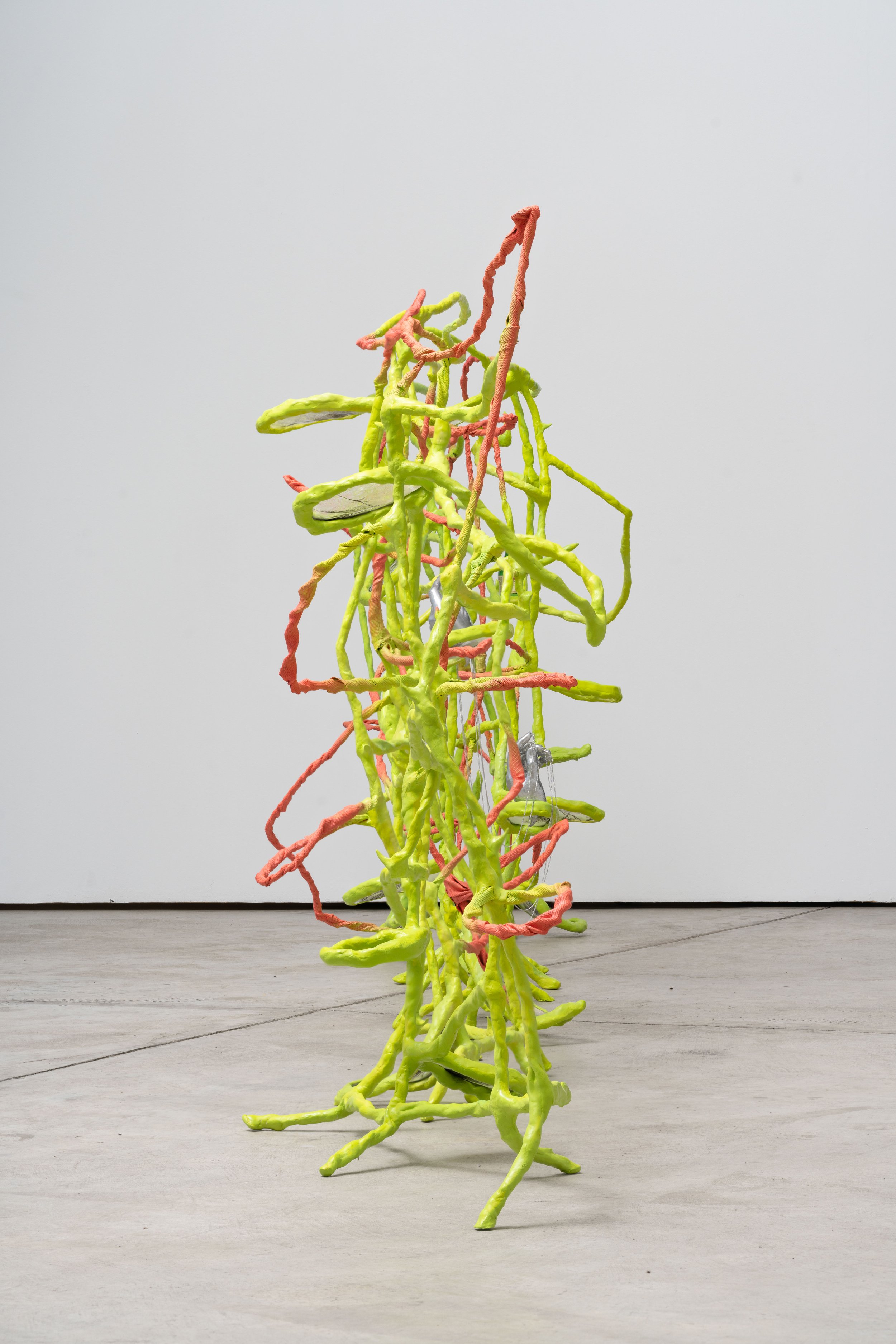 Kim Garcia, remedies, 2023
Epoxy clay, resin, peacock feathers,
medical casting tape, DuoMatrix, necklace
chains, and half empty sake bottle.
48” x 203” x 24”