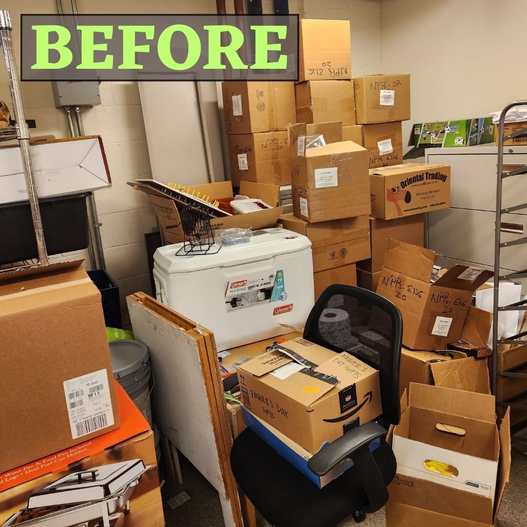cluttered corner of a storage room with unlabeled boxes stacked on top of one another