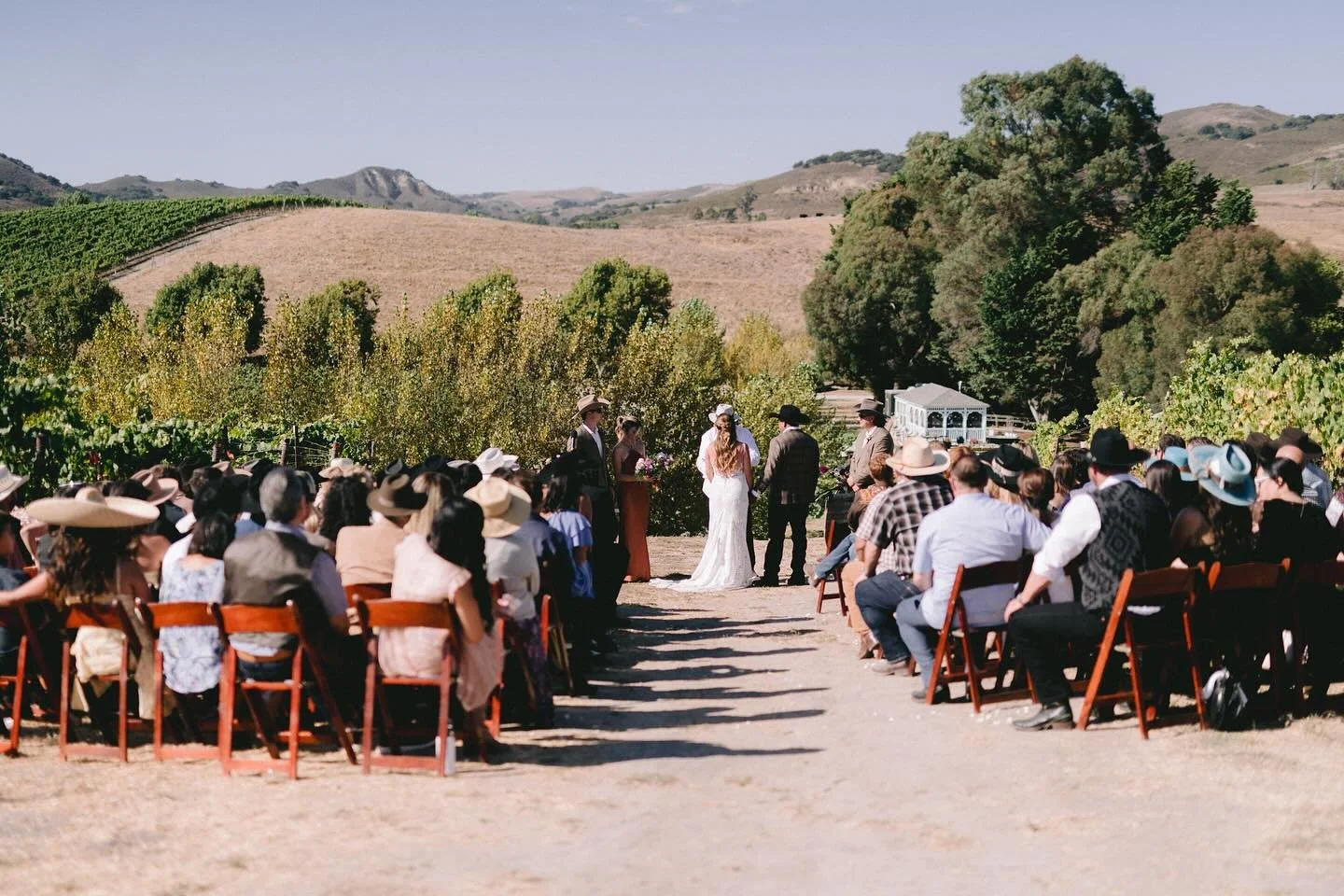 J+N&rsquo;s ceremony site was a hilltop clearing nestled between rows of vines as far as the eyes could  see. From the top the couples ceremony site could be seen down below. Beautiful day for a beautiful couple.