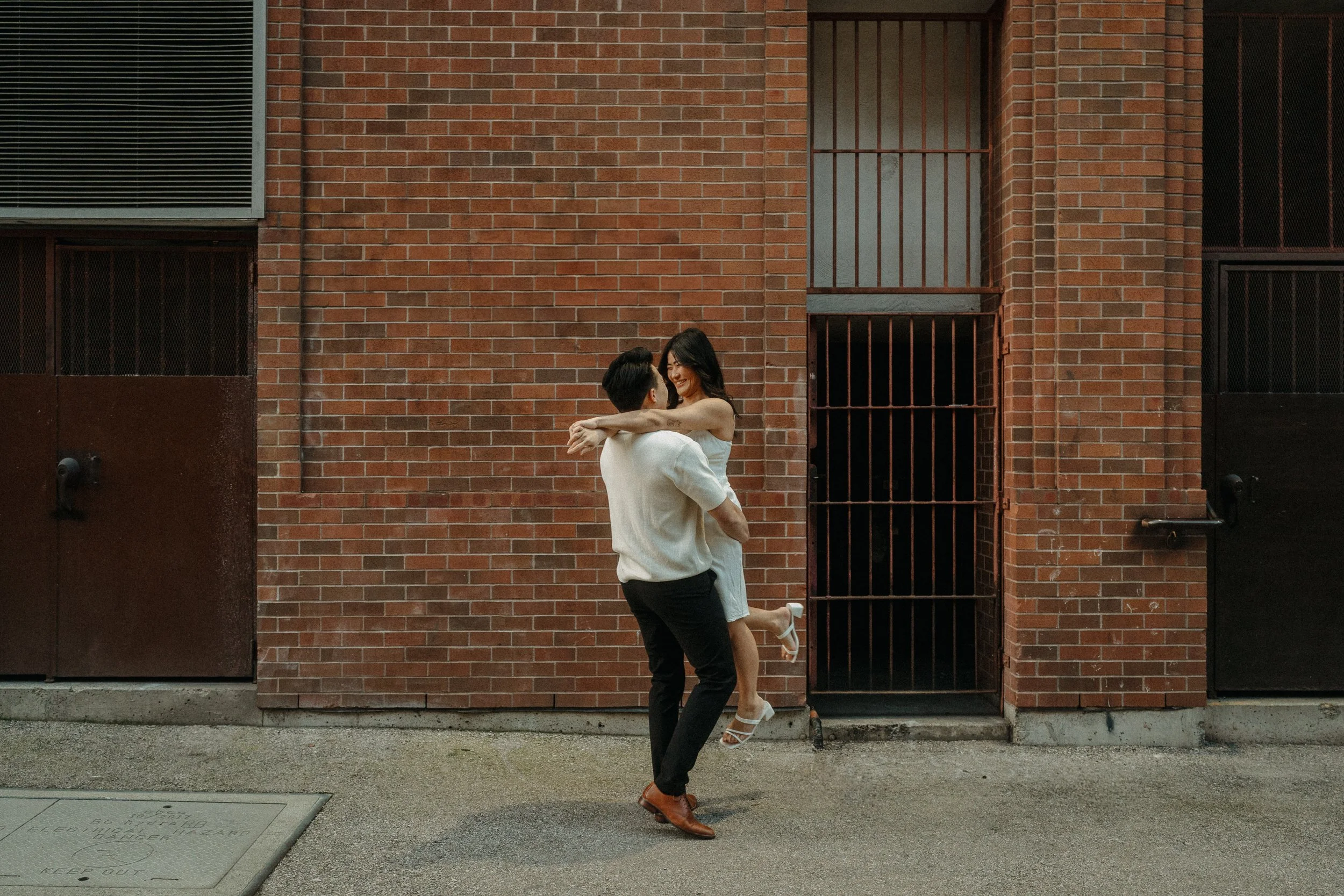Dancing couple in Vancouver Chinatown Engagement Session