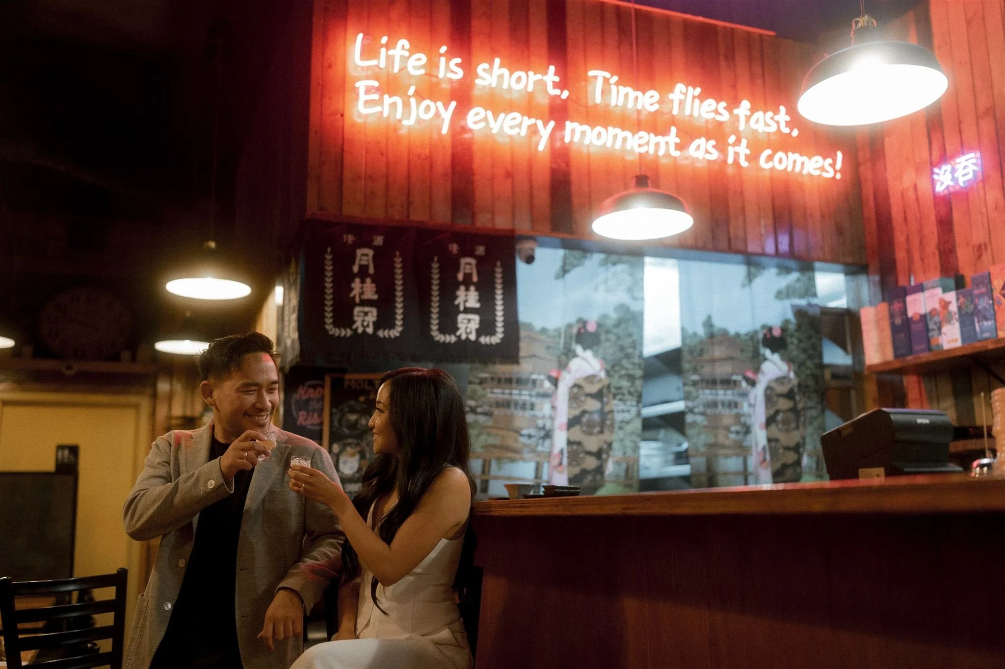 couple having sushi in engagement session