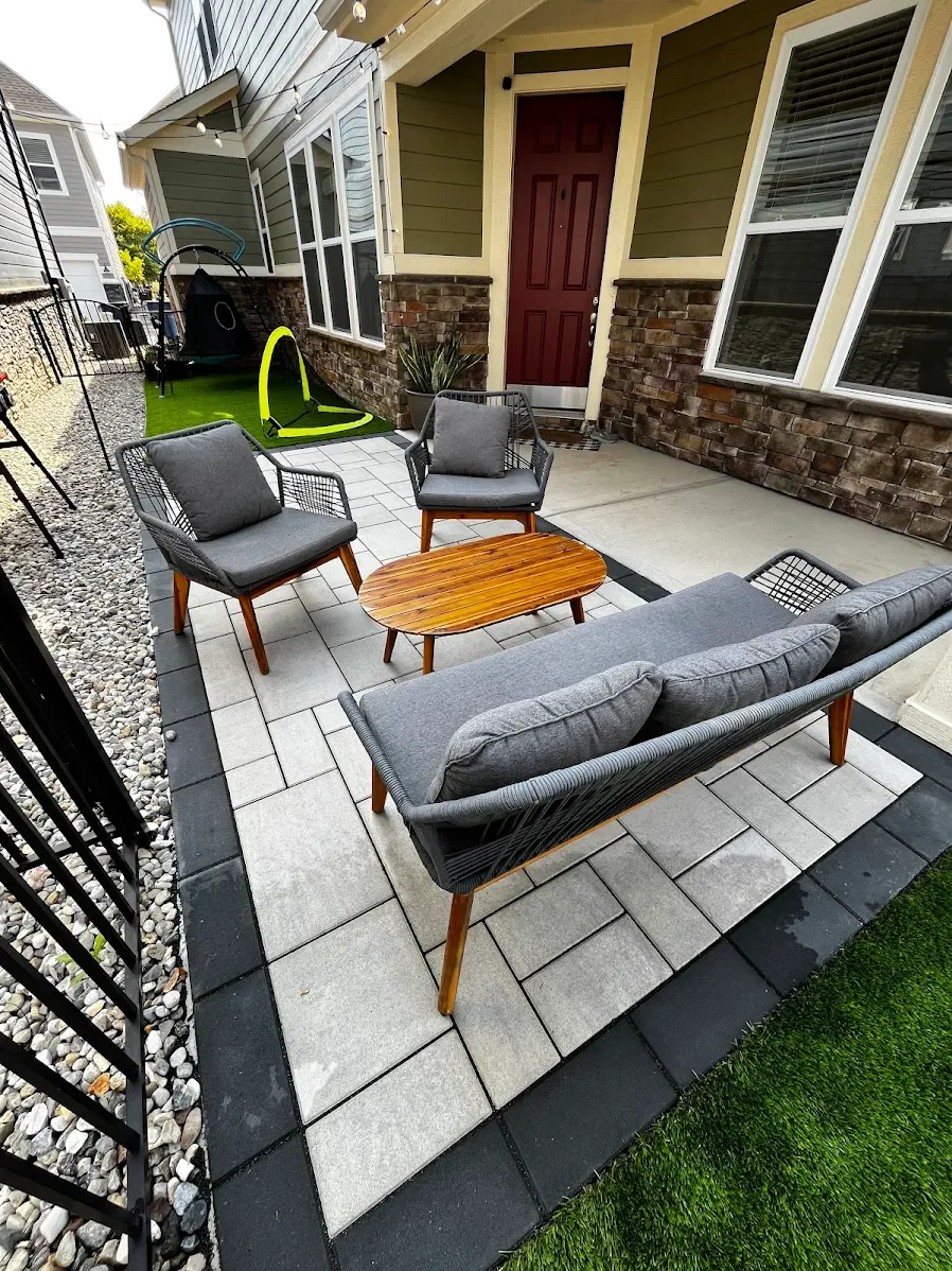 Custom modern paver patio installation with dark border stones by B&F Landscaping in Indianapolis, Indiana