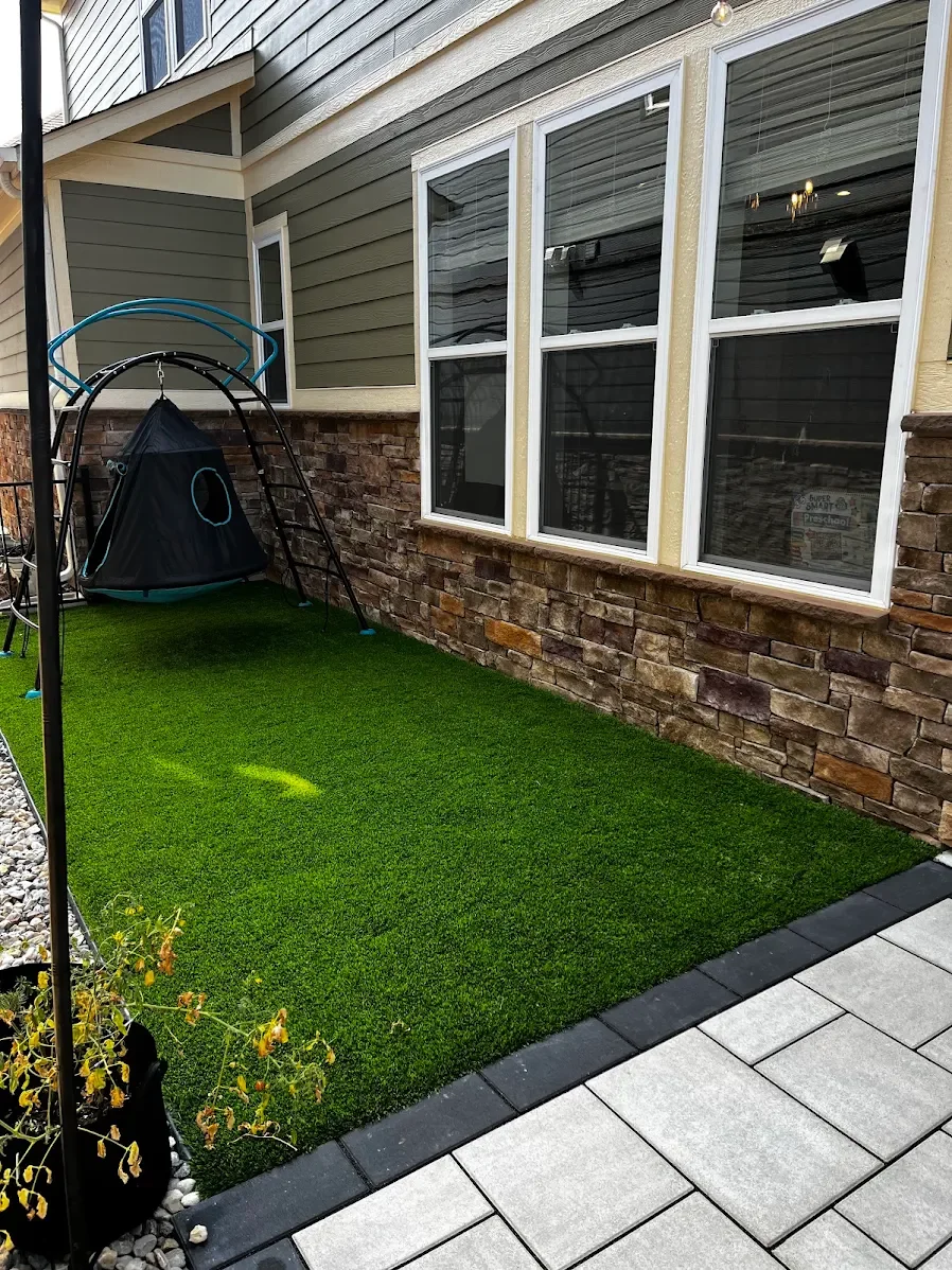 Premium artificial grass installation in a backyard play area by B&F Landscaping in Indianapolis.