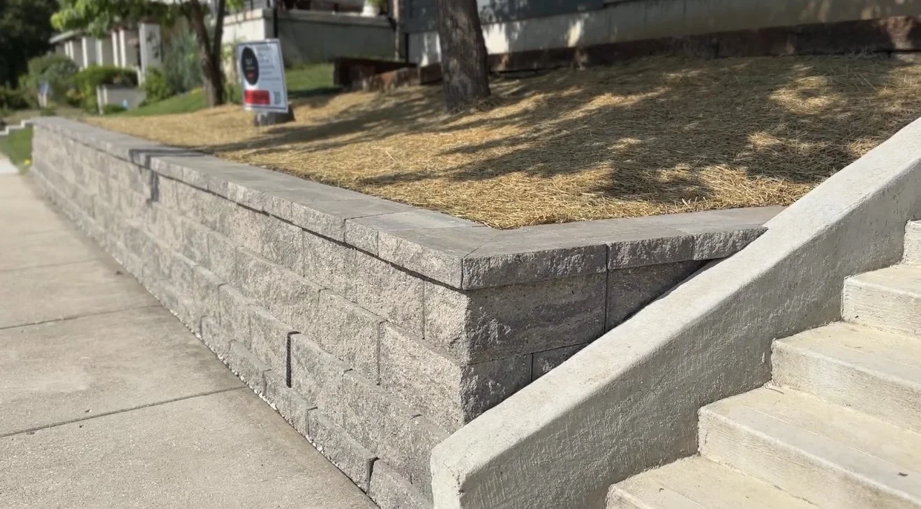 Professional stone block retaining wall installation, completed by B&F Landscaping in Indianapolis