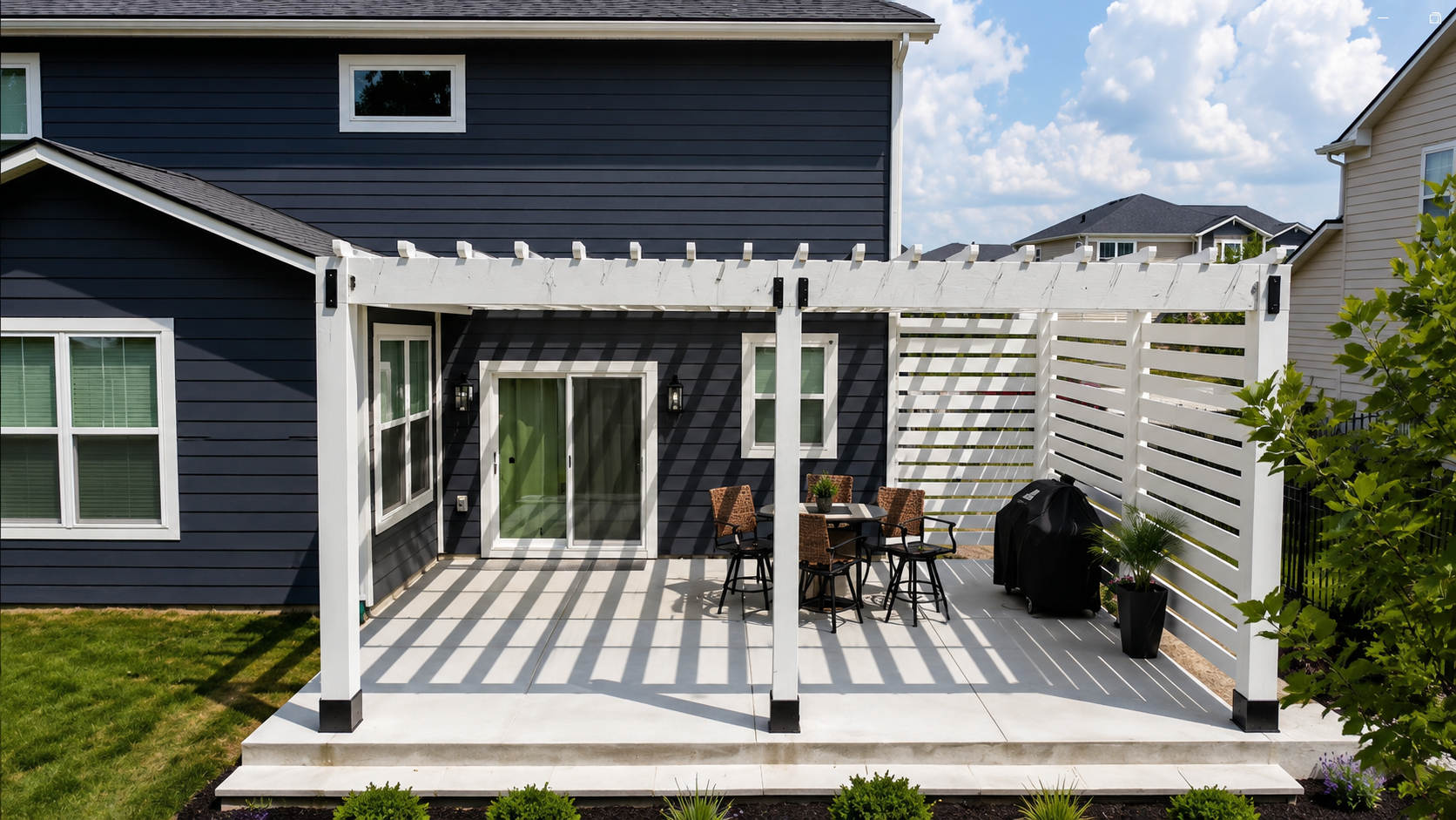 White attached pergola installed over a backyard patio in Indianapolis, Indiana.