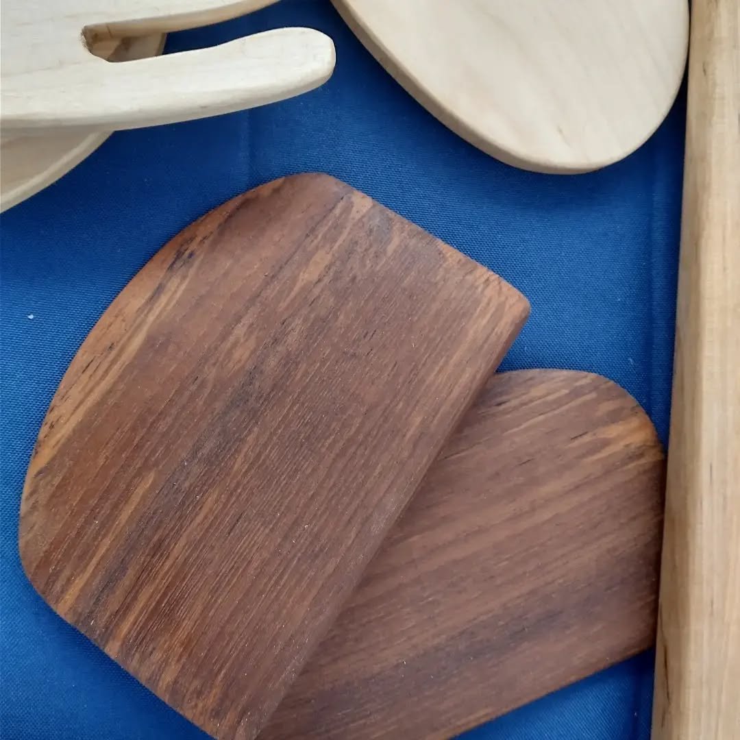 A few new additions for this week's market. Salad fingers, bottle opener, cake server, bread dough scraper, holiday boards. Kind of windy and rainy, but people are shopping.