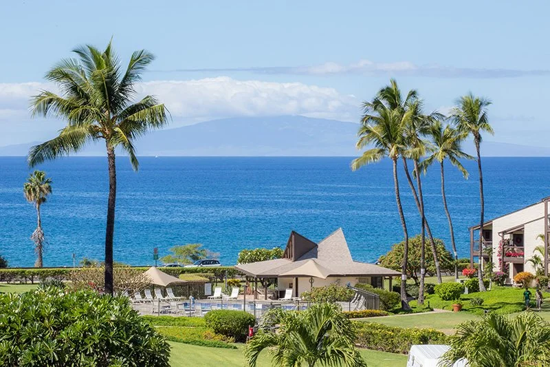 Hale Kamaole vacation rentals in South Kihei, Maui with pool, tropical grounds, palm trees and Pacific Ocean view