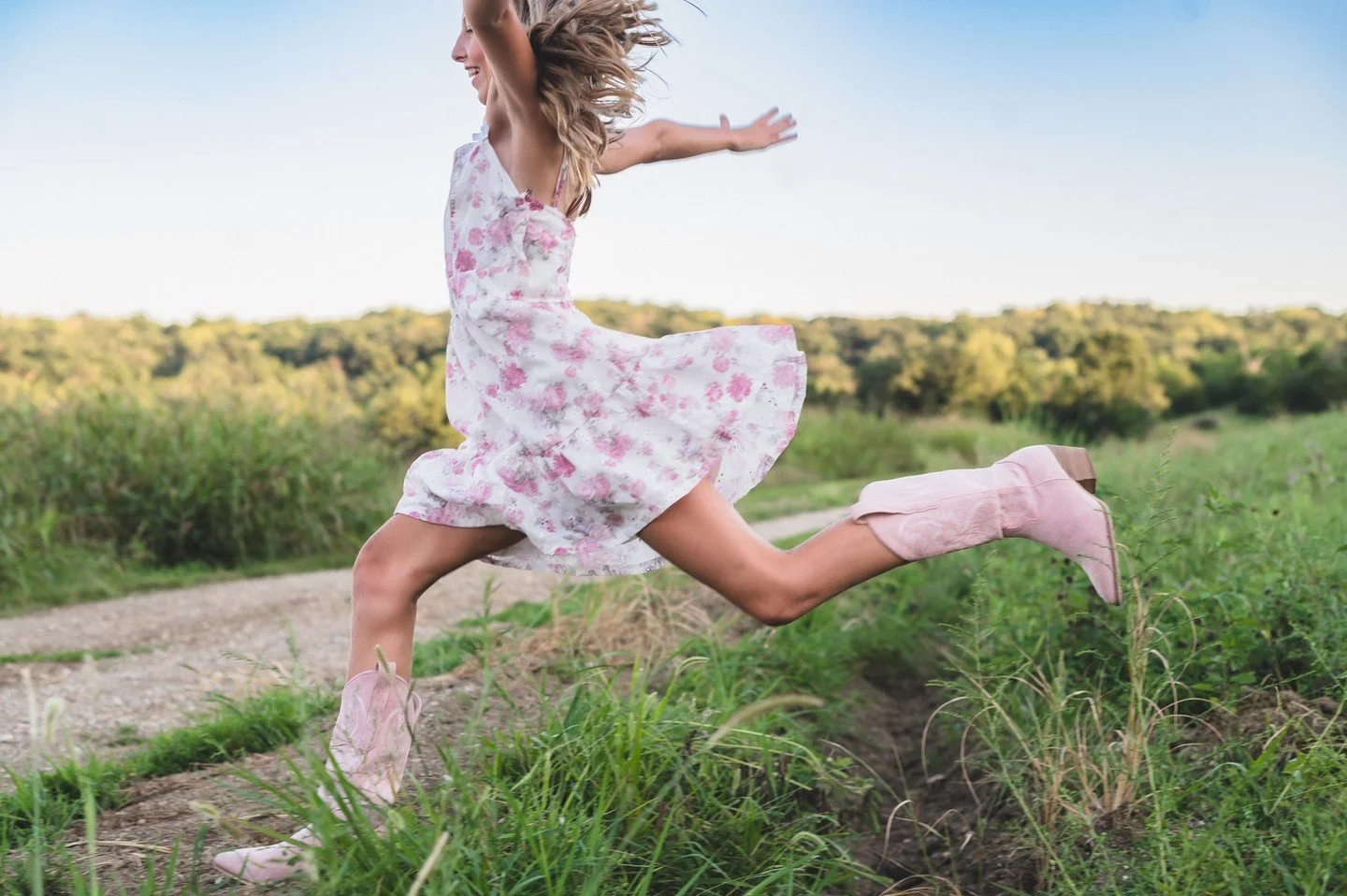 Can we talk about what to wear for family photos for a second? Because this right here is a great example.

Floral, feminine, movement-friendly. A dress that photographs beautifully and lets a kid actually be a kid.

Here's my general rule: wear what