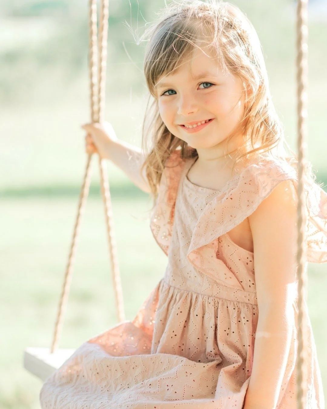 This is childhood - the rope swing, the sundress, that look on her face like she's got the whole world figured out and it's a really good place to be.

Spring mini sessions for families are open &mdash; and I would love to capture your little ones ex