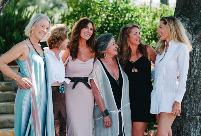Lizanne Falsetto with a group of women leaders at a retreat